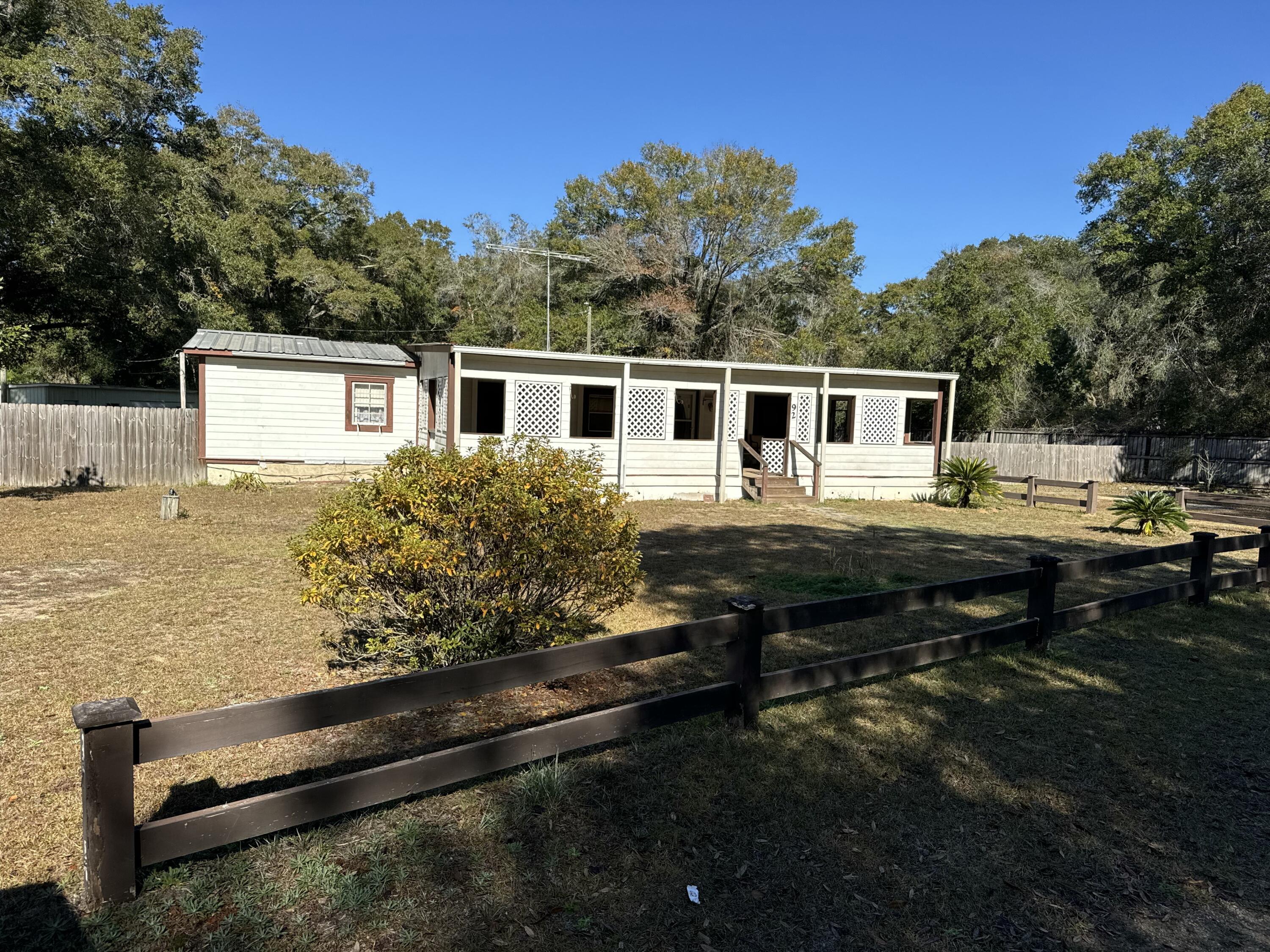 Investor special! This double-wide trailer sits on .83 acres and offers endless potential with some updating and repairs. The spacious lot provides plenty of room for future improvements or outdoor projects. Whether you're looking to renovate and flip, create a rental property, or start fresh, this property is a great opportunity for the right buyer. Sold as-is, ready for your vision to bring it back to life!