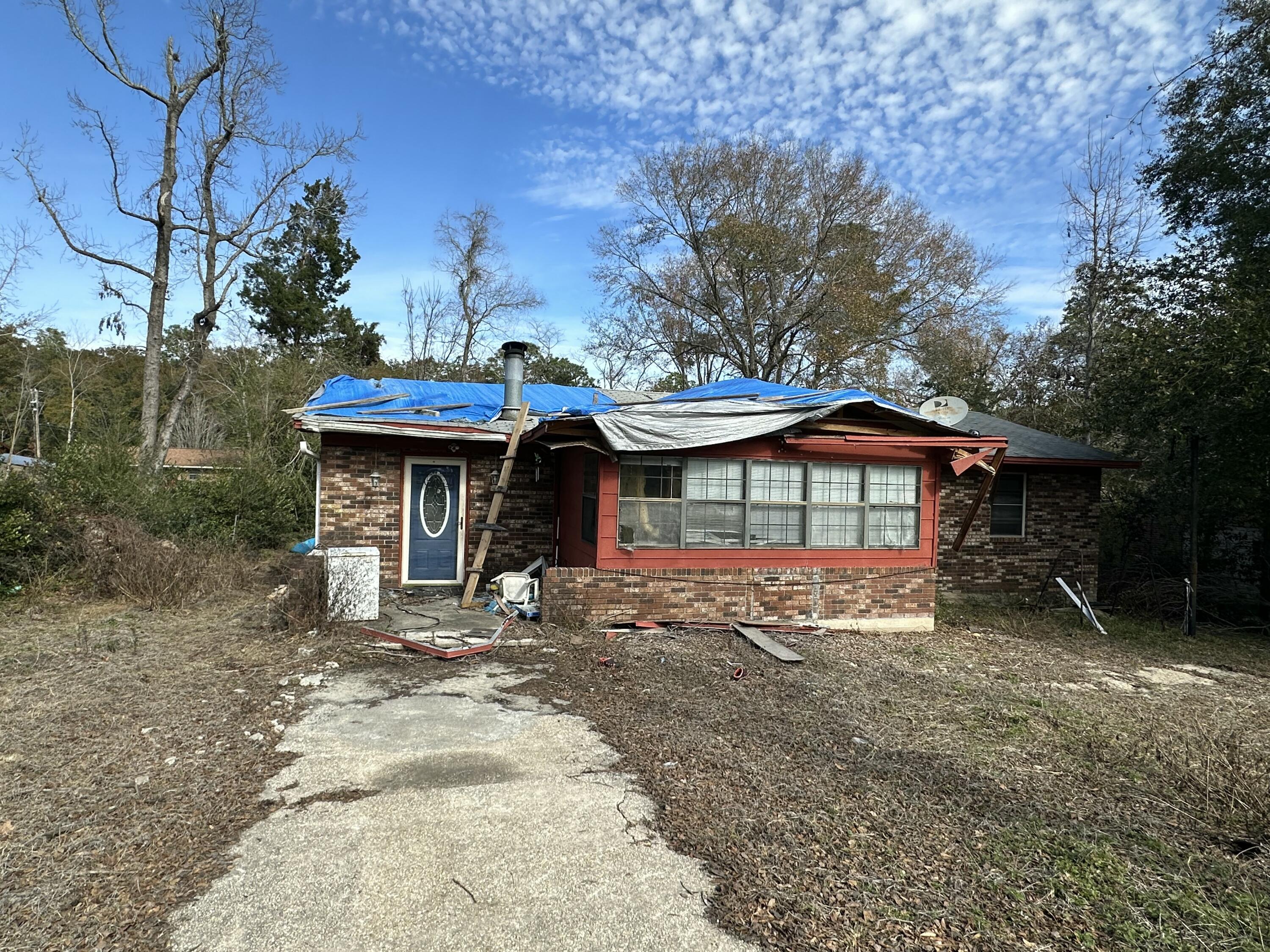 Property being sold As-Is with NO home value and a Level Building Lot.