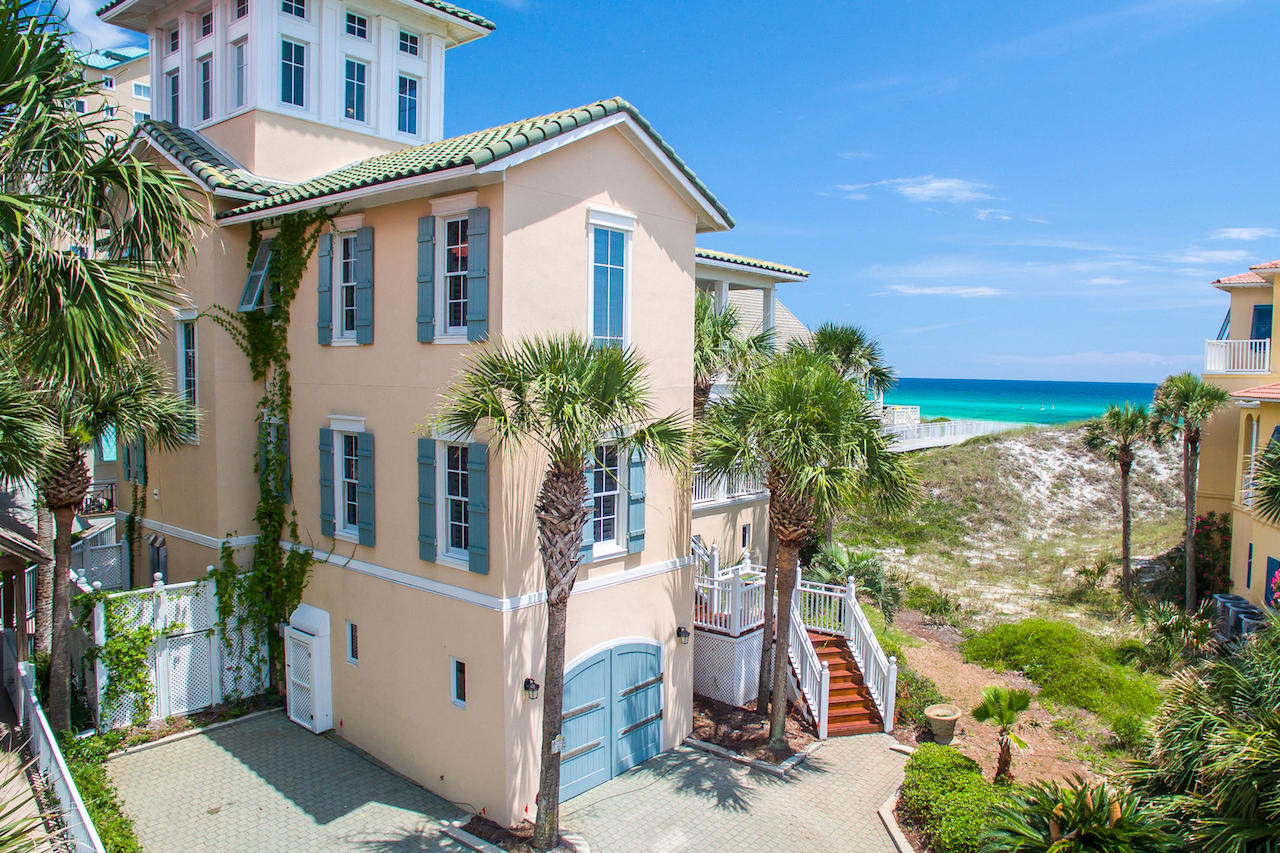 Currently under contract with contingencies. Seller still accepting offers as a 72 hour ''kick out'' clause is in place. Corridor gulf views and deep breezy balconies combine for the ultimate in beach living at 309 Rue Martine. Renowned architect Tom Christ created this retreat to merge the inspiration of the sea with memorable architecture. Just one row back from the Gulf of Mexico, this home's beach walkover provides rare direct passage to Caribe's private, snowy white beaches.Located on a quiet cul-de-sac, exclusivity and privacy compliment relaxed coastal living. Second floor living spaces are perfectly positioned to capture views of emerald green waters and allow for single floor living with a bedroom, bath, kitchen, living, dining, and wrap-around balcony all located on the same floor.
Tastefully decorated yet pleasantly relaxed, interiors beg guests to sit back and stay awhile. Exposed rafters and upholstered wicker hint at an earlier time and compliment modern conveniences. In this home, you know upon entry that you are destined to have a good time. All furnishings are included with the purchase of this home including French antiques and original art. White linen slip covers contrast with stained hardwoods for a play on crisp coolness against chestnut imperfection. Understated interiors are careful not to compete with this home's focus on the water. Downstairs is reserved for laid back living with multiple sleeping areas and its own private living space. Directly off the beach walkover and conveniently adjacent to the private garage, this floor provides a private retreat for a family or a lively group of kids. The third floor provides safe haven for more guests with two additional bedrooms with private baths. The mood on three remains casual and attention remains on the water. Sunset begins and ends in the top floor widow's walk with wall-to-wall windows. 360-degree views renew the senses and calm the anxious soul. This charming residence is conveniently located in the guard-gated, gulf front neighborhood of Caribe in South Walton County. Caribe boasts some of the Emerald Coast's broadest private beaches and offers chair service. Two private pools and tennis courts are included in this sidewalk neighborhood. Caribe does allow limited vacation rentals. 309's owner supplements operating costs with $95,000+ in annual rental income. Please call today for your private showing.