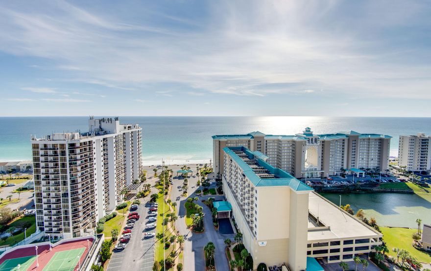 Great 1 bedroom/1.5 bath with outstanding views of the Gulf of Mexico. This one bedroom features tile through out living area, granite counter tops and stainless appliances. Enjoy the two large pools totaling approximately 12,000 square feet as well as convenient deeded access to over 2,000 feet of white sugar sand beach which is less than 200 yards away. Ariel Dunes is located in Seascape - a gated community offering amenities such as golf, tennis, pools, and a conference center. Great rental or second home! All measurements are approximate and should be verified by buyer.