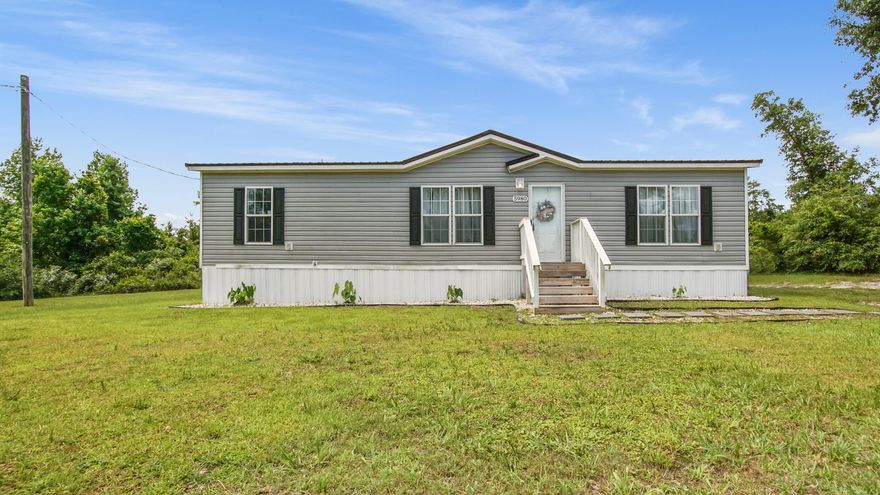 Welcome to your peaceful retreat in Youngstown! Built in 2020, this beautifully maintained 3-bedroom, 2-bath manufactured home offers the perfect blend of modern comfort and country charm. Situated on just under 3/4 of an acre, there's plenty of room to spread out, entertain, or simply enjoy the serene surroundings.Step inside to discover a bright and airy open floor plan enhanced by gorgeous luxury vinyl flooring that flows seamlessly throughout the entire home. The spacious living room features a cozy electric fireplace ideal for relaxing evenings.The heart of the home is the stylish kitchen, complete with a large island, tiled backsplash, and sleek stainless steel appliances--perfect for entertaining or family meals. Adjacent to the main living space is a generous 12' x 20' bonus room with laundry hookups, offering flexible space for a home office, playroom, or additional living area.

The private primary suite offers a spa-like escape, featuring a double vanity, deep soaking tub, stand-up shower, and a spacious walk-in closet. Two additional bedrooms and a second full bathroom provide comfortable accommodations for family or guests.

Enjoy outdoor living on the expansive 12' x 28' covered porchideal for weekend barbecues or peaceful mornings with coffee. The large lot provides ample space for outdoor activities, gardening, or even adding a workshop or garage.

Located just a short distance from Cherokee Landing, you'll have quick access to scenic Deer Point Lake for boating and fishing, and only 9 miles from the beloved Econfina Creek perfect for swimming, kayaking, and family adventures.

Don't miss your chance to own this move-in-ready home that combines modern amenities, a spacious layout, and a fantastic location. Schedule your private