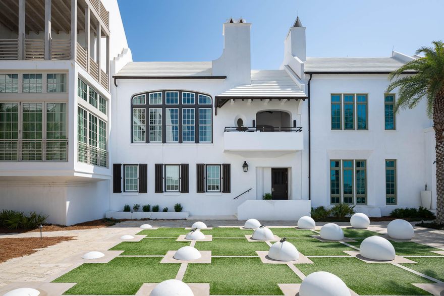 Life is defined by the new home offering of 32 Kings Castle Court located south of Scenic Highway 30A.  This custom home is aligned on the iconic Turtle Bale Pedestrian Path leading to the Gulf of Mexico.  Architect Gary Justiss' talents provided harmony in design capturing this four-bedroom home's livability & interconnected private outdoor amenities.   The main living level is an entertainer's dream featuring 3 distinguished outdoor amenities which include a swimming pool with sunning deck, a screened patio loggia featuring a summer kitchen to dine al fresco, capped with a second-floor balcony loggia overlooking Turtle Bale Pedestrian Path.  This loggia provides views of the western sunsets furnished to relax in front of the outdoor fireplace & TV.  A combination of French Doors & bi-folding door systems bring the indoors & outdoors together.  

The primary bedroom suite is an oasis within itself outfitted with custom window treatments, stunning tile & stone work within the bathroom, and a soaking tub cast within a grotto.  Additional, attributes provided are the very generous closet with custom cabinetry that leads into a family office & workout room all contained within the primary's envelope.

Each of the 3 guest bedrooms offers en suite bathrooms, beautiful custom built-in cabinetry in addition to walk-in closets.  Each bedroom offers the desired comfort & privacy for your guests.  

32 Kings Castle Court consists of all met needs for an Alys Beach homeowner.  This property is a must see.  
