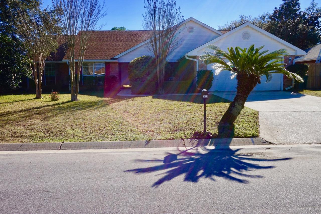 Welcome home to true family living space. These 4 bed / 2 bath home offers a separate dining room and huge den ~ Open to the family room with soaring focal point brick fireplace ... flowing through to the breakfast nook and kitchen with breakfast bar, pantry and lots of cabinet space. Huge master bedroom /master bath offers his and hers closets ~double vanity ~ step in shower tub and closed off WC.Split floor plan with good size additional bedrooms and bathroom with step in tub/shower. Home is situated on a good size lot with fully fenced back yard ~open patio and additional storage shed ~front porch to sit out and enjoy those wonderful Florida evenings. Martha's Cove has easy access to Hwy 98, local stores the Navarre beach bridge, minutes from the schools & Hurlburt Field AFB all this an