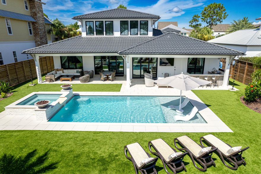 Discover an exceptional blend of sophistication and modern living in this exquisite West 30A home, which is being offered FULLY FURNISHED, and is nestled within the exclusive, gated community of Cypress Breeze. From the moment you step inside, the superior craftsmanship and attention to detail are evident, offering a lifestyle of luxury that's hard to find. The grand entrance sets the tone, with soaring ceilings and a striking staircase that creates a sense of grandeur. The open-concept great room is the heart of the home, designed for both intimate gatherings and lavish entertaining. Expansive glass sliders seamlessly connect the indoors with an outdoor paradise, where lush landscaping and a stunning pool with a spa, fire, and water features await. This outdoor oasis is further enhanced by a summer kitchen and bar, perfect for al fresco dining in complete privacy.

The gourmet chef's kitchen is a culinary masterpiece, outfitted with the finest appliances, including a Wolf range, Sub-Zero refrigeration, Cove dishwasher, and a Miele coffee system. Quartz countertops, luxury fixtures, and a gas fireplace in the living area elevate the space to new heights of elegance.

The primary suite, conveniently located on the main level, is a true retreat. The en-suite bathroom rivals the finest spas, featuring an infrared sauna, wet room, soaker tub, and lighted mirrors, all set against a backdrop of exquisite tile work.

This home offers versatile living options with a guest room and en-suite bath on the main level, a powder bathroom with indoor and outdoor access, and a spacious laundry room. The oversized two-car garage and additional third garage bay provide ample space for vehicles and storage. Upstairs, two more guest bedrooms and a beautifully appointed guest bathroom, make this home perfect for families and guests alike.

Crafted with the finest materials and equipped with advanced smart home technology, this residence includes cement board stucco siding, a steel tile roof, Italian porcelain driveway and patios, and a whole-home water filtration system. Additional features that set this home apart include high-tech security, landscape lighting, a pantry that doubles as a safe room, a Sonos music system throughout, Nest WiFi CO2 and smoke detectors, automated pool controls, WiFi thermostats, and outlets for holiday lighting.

Cypress Breeze provides a private, gated experience with an oversized resort-style pool, all within a short stroll to the beach and close to the upscale dining, shopping, and entertainment that make 30A so desirable. Whether you're seeking a primary residence or a luxury investment property, this home is a rare opportunity to live the ultimate 30A lifestyle.