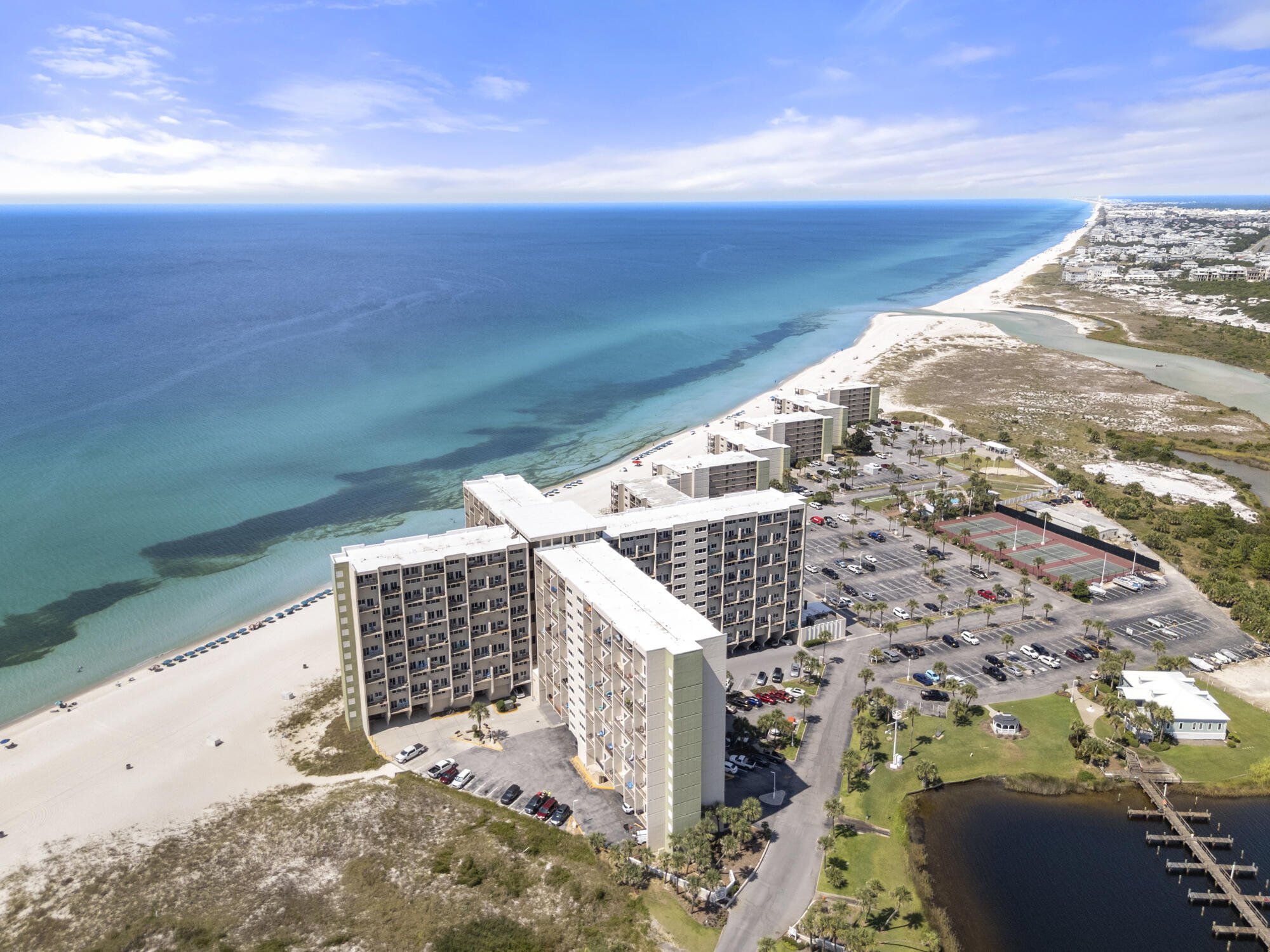 Experience coastal living at its finest in this beautifully updated 3-bedroom, 3-bath Gulf-front condominium at Pinnacle Port! Spanning 1,244 sq. ft.,this rare townhouse-style unit offers sweeping views of both the Gulf of Mexico and Lake Powell. The interior features updated finishes, and a bright openlayout perfect for entertaining. The kitchen comes equipped with modern appliances, while multiple balconies showcase stunning water views. The primarysuite includes its own private balcony--ideal for morning coffee or sunset unwinding. Pinnacle Port is a gated beach community uniquely positioned between30A and Carillon Beach, offering the best of both worlds: tranquil lakefront living and direct Gulf-front access. Resort-style amenities include two swimmingpools, fitness center,