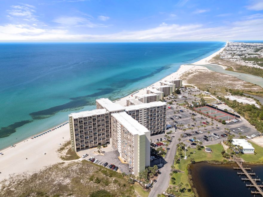 Experience coastal living at its finest in this beautifully updated 3-bedroom, 3-bath Gulf-front condominium at Pinnacle Port! Spanning 1,244 sq. ft.,this rare townhouse-style unit offers sweeping views of both the Gulf of Mexico and Lake Powell. The interior features updated finishes, and a bright openlayout perfect for entertaining. The kitchen comes equipped with modern appliances, while multiple balconies showcase stunning water views. The primarysuite includes its own private balcony--ideal for morning coffee or sunset unwinding. Pinnacle Port is a gated beach community uniquely positioned between30A and Carillon Beach, offering the best of both worlds: tranquil lakefront living and direct Gulf-front access. Resort-style amenities include two swimmingpools, fitness center,