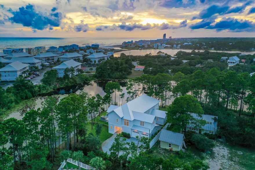 Phenomenal fully furnished 6-bedroom, 6.5-bath lakefront home boasting 4,753 sq ft & 2-car garage located in the heart of 30A with no HOA fees! This home is positioned at the end of the street on Lake Tresca, offering tranquility & the luxury of privacy. Nestled between Eastern Lake & Deer Lake, the home is surrounded by natural beauty & pines. Just a short walk, bike, or golf cart ride away from having your toes in the sugar-white sand along the emerald green & crystal blue waters of the Gulf of Mexico! Walton Dunes Beach Access is just 1/2 a mile away & Eastern Lake Beach Access is only a mile away. Enjoy coastal living with incredible outdoor spaces including the large pool overlooking the lake, hot tub deck, wraparound balcony with gas grill & stunning views, and paver stone courtyard.