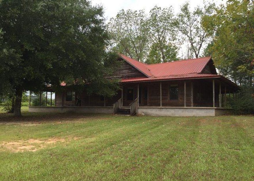 REO ~ Quiet Country Living on over 2 acres...! This 4 Bd / 1.5 Ba home is situated on over 2 acres in Baker. You'll enjoy summer breezes from your large wrap around porch. The home features metal roof & there is barn with metal roof as well. There are potentially structural issues. Please be sure to review the attached inspection. This property is eligible under the Freddie Mac First Look Initiative through October 6, 2015.