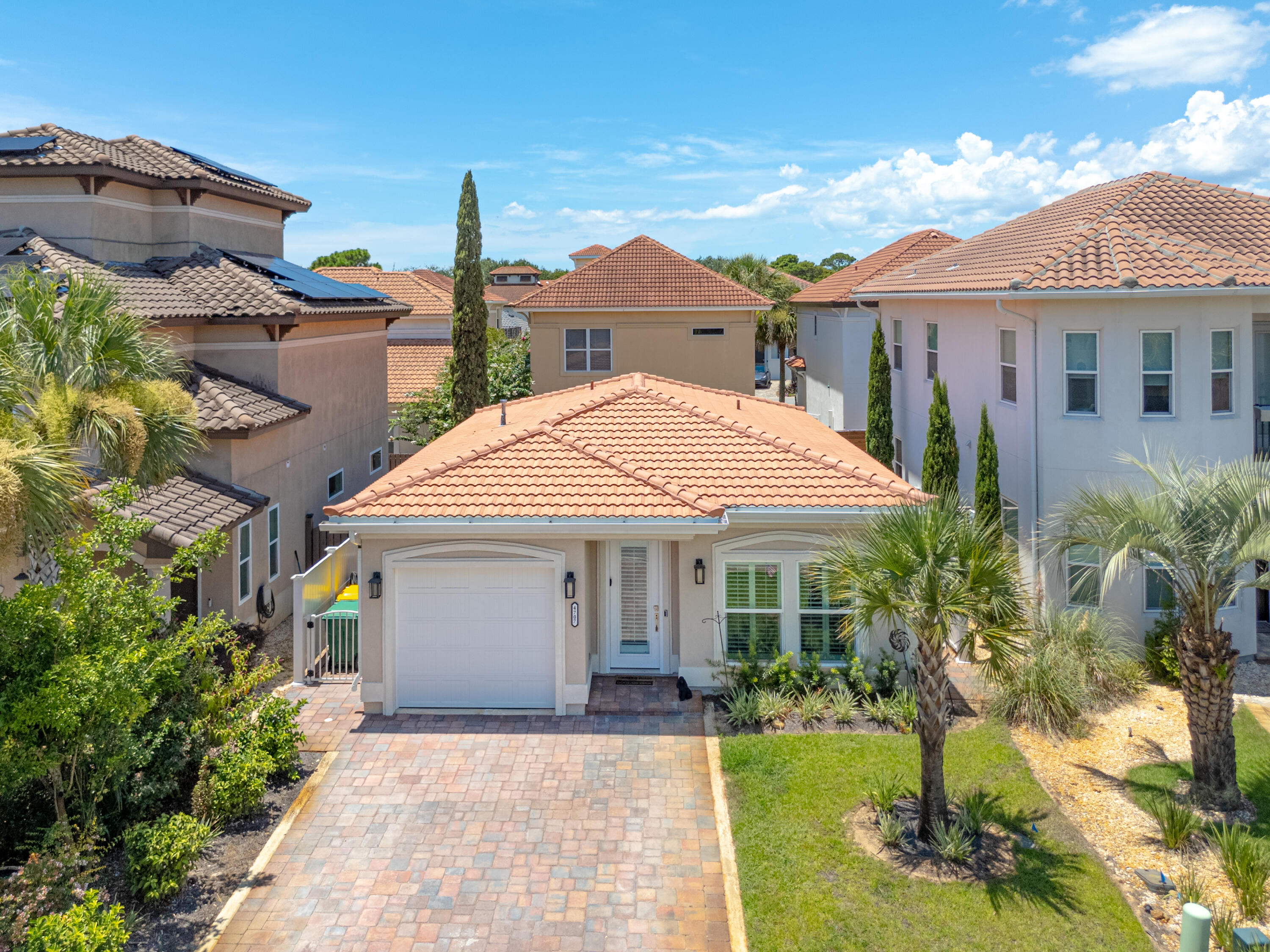 ONE-OF-A-KIND! This exceptional Calusa Bay home has never been on the market. Constructed just two years ago by a reputable, local builder, it is one of the very few SINGLE-STORY homes in the whole community. This custom build was meant to be a forever home and has ALL the upgrades you would anticipate. Upon entering you will observe the spacious 9ft ceilings, plantation shutters on all windows, and lovely built-in gas fireplace with cabinets. The open concept flows to the modern kitchen with top-of-the-line quartz countertops, gas stove, and stainless steel appliances. Being a 2023 home means everything is only 2 years old! Both bedrooms are situated at the rear of the home and each features an en-suite bath, privacy windows, and sliding glass doors to the back patio. Each bathroom is GORGEOUS and features a frameless glass tiled shower with a tub/shower combo in the second bath. Inside the laundry room is a sink and additional cabinet space. Plus the existing washer and dryer will remain with the home. Outside on the paver patio is plenty of space for entertaining and relaxing. There is a tall fence for privacy and a retractable awning along the length of the patio to keep things shaded on summer days. The one-car garage is convenient for a vehicle or additional storage. Plus, there is a Generac generator for peace of mind.
Calusa Bay boasts comparatively low HOA fees while still being a gated community with a refreshing community pool for residents to enjoy. No short term rentals are allowed, which contributes to the neighborhood atmosphere. It's a golf-cart friendly community and only a short drive to the Regatta Bay Golf Club. The location is superb. It is less than 2 miles to Destin Commons with 85+ shopping and dining options including Whole Foods, Lowe's, and many top-rated restaurants. There are also several beach accesses within a few miles of the home to enjoy beautiful white sand and Emerald water. Schedule your showing today!