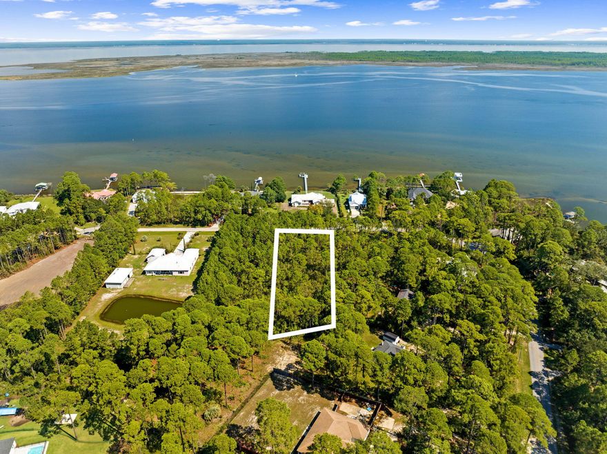 Just under a Full Acre Lot with Scenic Views!Experience the charm of Woodland Bayou Estates, one of Santa Rosa Beach's finest hidden gems. This nearly one-acre lot offers breathtaking views of Hogtown Bayou, with the potential for glimpses of Musset Bayou as well. This exclusive neighborhood features a single, serene street adorned with exquisite waterfront custom homes set on spacious lots, providing both privacy and a sense of community.With a low HOA and minimal taxes, this tranquil enclave is accessible via a secure entrance leading to a peaceful cul-de-sac. Conveniently situated off Don Bishop Road, just north of Highway 98, Woodland Bayou Estates ensures effortless access to shopping, entertainment, healthcare, and the pristine beaches of South Walton & Hwy 30A!
