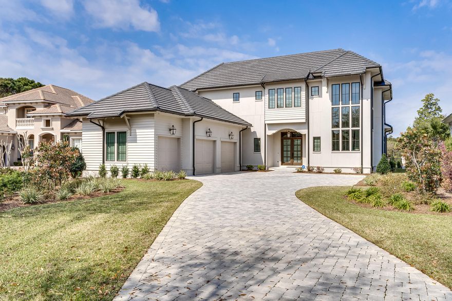 This beautiful home is located in Regatta Bay, sitting on a par 3 with a beautiful lake view. Featuring a great open floor plan with plenty of room for entertaining and relaxing. It has 2 bedrooms downstairs and 2 bedrooms plus a bonus room upstairs. Many UPGRADES: In ground heated pool, outdoor kitchen, custom Lafayette lustrations blinded blinds, custom electric chandelier with winch, 22kw water cooled home generator, tankless hot water heater, energy efficient LED lighting, energy efficient spray foam insulation. Custom gutters with subsurface drainage. ADT security system, power coated aluminum security fence, stained pecky cypress fireplace wall and ceiling in living room. Thermador appliances.Home has 5,500 total square feet including garage and covered outdoor living area! Washable stain painted walls, enlarged driveway, decora light switches  throughout home, completely decked storage area above garage. Custom gutters with subsurface drainage. ADT security system, power coated aluminum security fence, stained pecky cypress fireplace wall and ceiling in living room. Washable stain painted walls, enlarged driveway, decora light witches  throughout home, completely decked storage area above garage. Still under builders warranty.