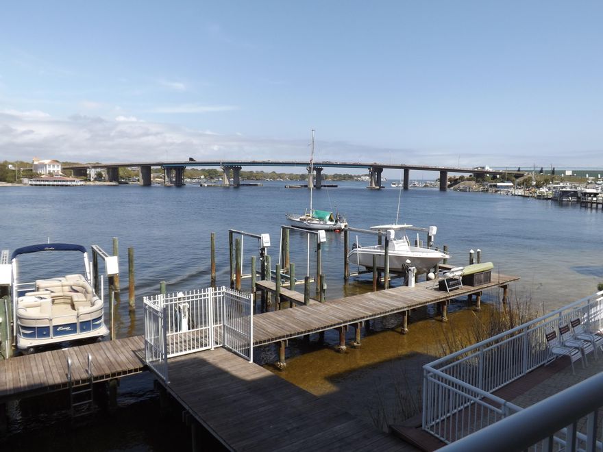 Gated, waterfront condo community on inter-coastal waterway. Fully furnished 2 bed/2 bath with boat slip, beautiful water views and assigned, covered parking. Unit is in excellent condition and ready to move in. Deeded Boat Slip #2 - one time transfer fee. Pool not currently heated, but will be in the very near future. No membership to a 'yacht club' - is yacht club in name only. Buyer to verify all measurements.