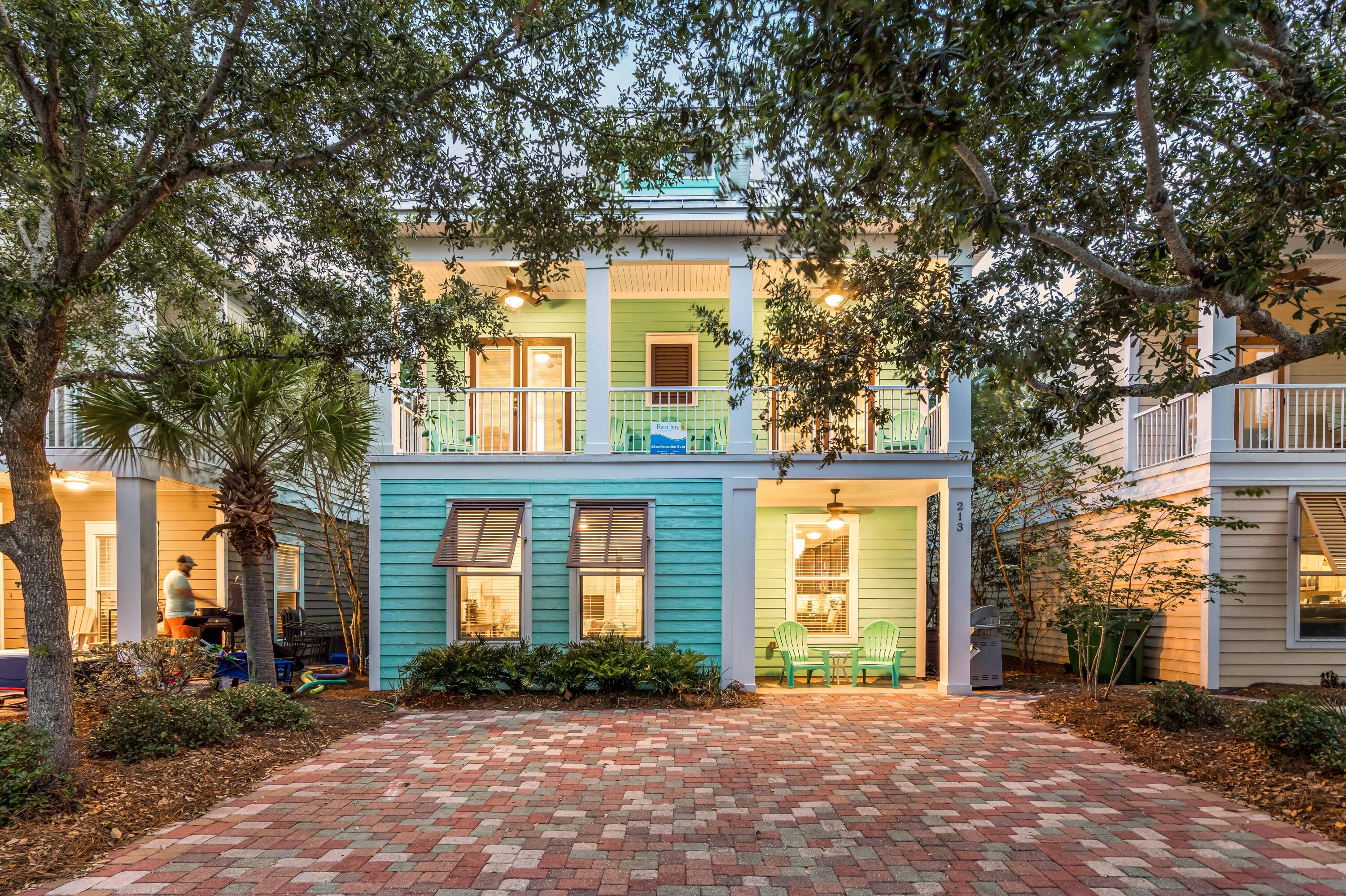 With one of the most stunning tropical resort style pools along the Emerald Coast, the popular, gated community of the Villages of Crystal Beach is an oasis between the shopping, dining, and entertainment of the Destin Commons and the sugar white sands of the beach a few blocks away. The 30,000 square foot lagoon style, zero-entry pool, complete with lush tropical landscaping, waterfall, spa, and grilling area with surround sound and flat screen tv, is the perfect place to plunge after a day at the beach. There is even a seasonal tram that will pick the family and all the gear up right in front of the house and shuttle you back and forth between the the community and the beach so no one needs to worry about beach parking.