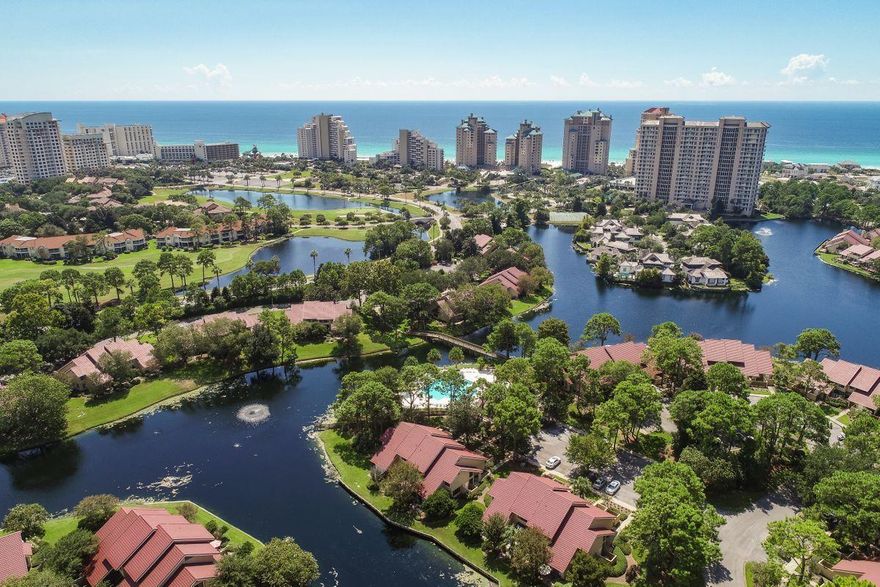 Lots of extras with this location!  This two bedroom two bath home has room for all of your family and friends with a bunk room for the kids too. Being located downstairs means its easy to carry in your luggage and your groceries. Being located on the end of the building means it has  extra windows making a light and bright backdrop for the colorful beach furnishings in the open living room/dining room/kitchen area. The floors are tiled throughout the common areas making it easy to clean up after sandy feet.The galley style kitchen is accented with glass front cabinets, solid surface counter tops.  The  cozy corner breakfast area has floor to ceiling windows and a sliding glass door that leads to a private courtyard with stucco walls if you prefer to have breakfast outside.