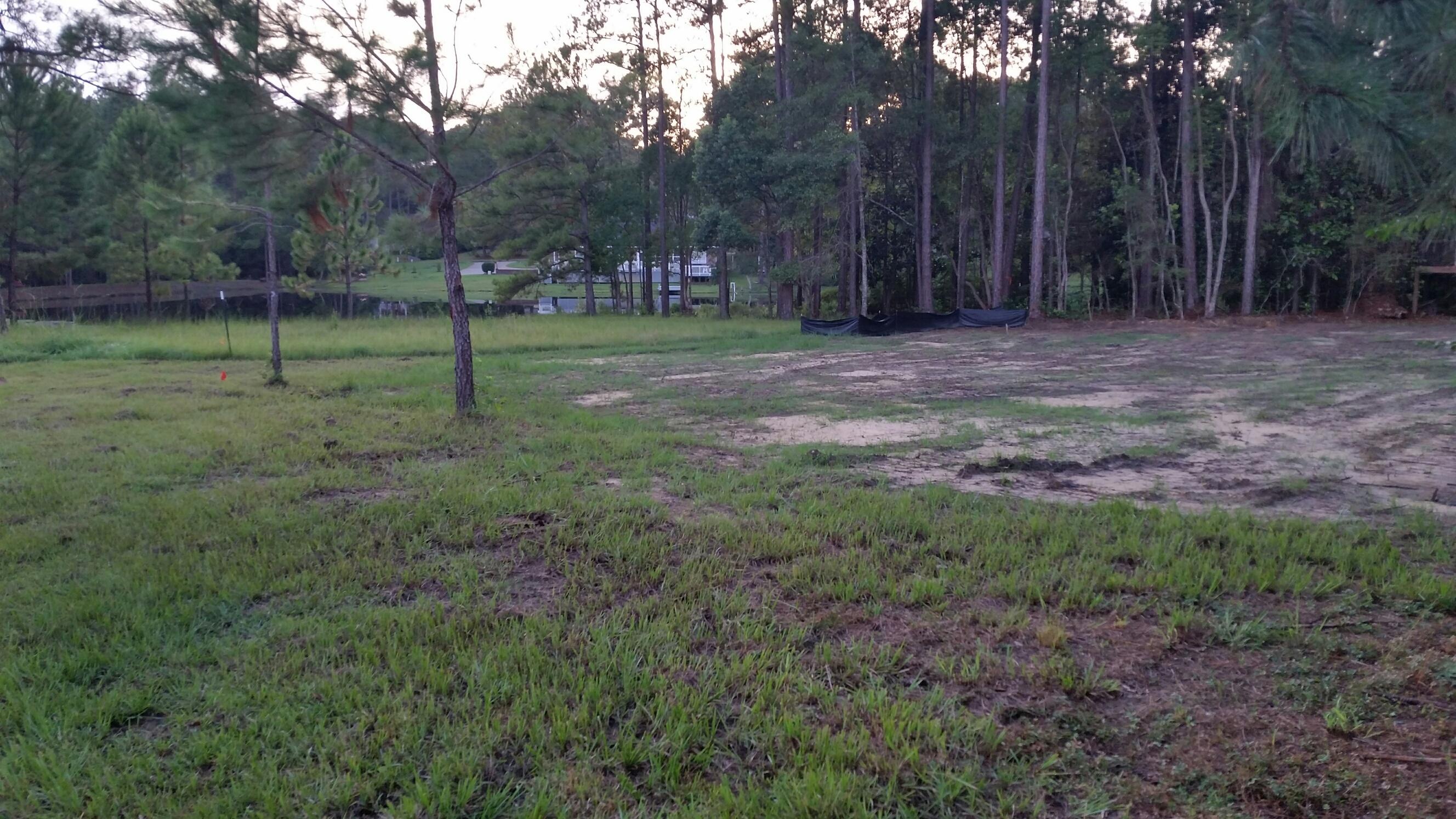 Improved lot ready to build your dream home in exclusive Pine Shores.