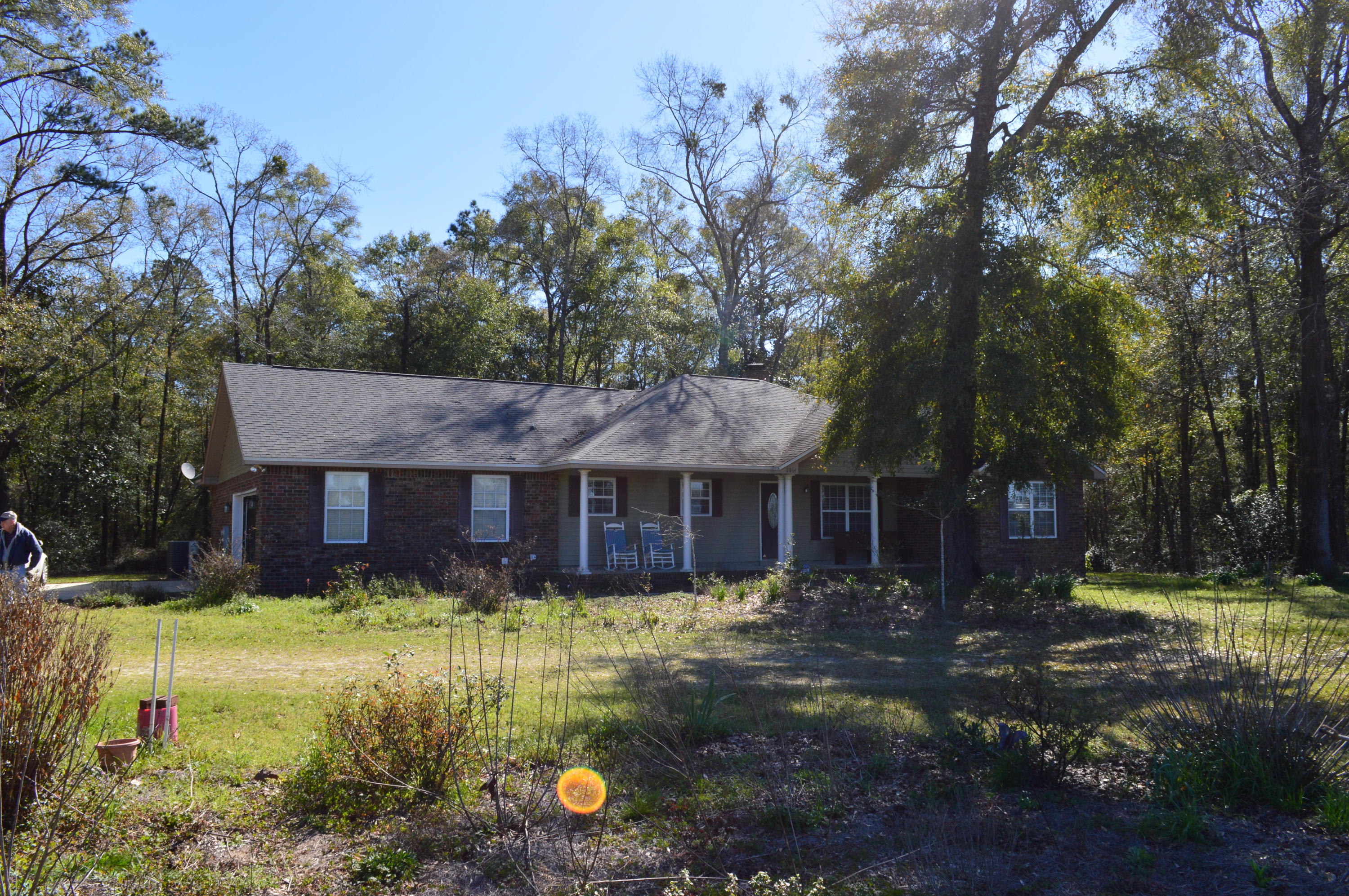 Fantastic country getaway on over 28 picturesque acres on a beautiful creek!!! Contemporary 3 bedroom and 2 1/2 bath brick home built in 2008. Split bedroom design with a very roomy master bedroom and bath with cultured marble vanity, garden tub and separate shower. Open concept floor plan with kitchen and breakfast area open to the living room with quaint fireplace. Additional bedrooms are ample size and offer plenty of closet space. As nice as the home is, the great wooded acreage and thousands of feet of creek frontage will capture your heart. Many varieties of timber, plenty of wildlife and a flowing creek with a little waterfall. What more could you want? Make your appointment today. Additional 46+ acres available for purchase on the other side of the creek.