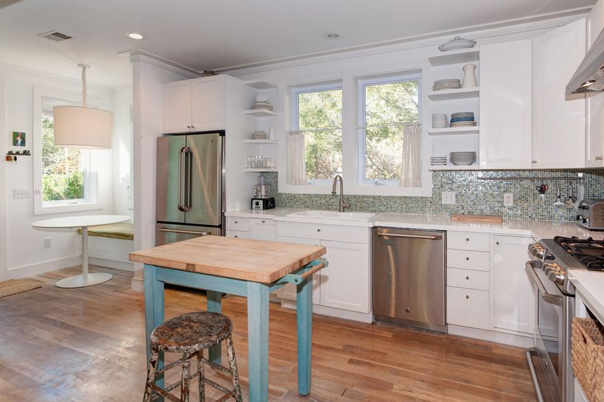 This charming beach cottage, featured in Southern Living Magazine, is close to several neighborhood accesses to the beach and emerald waters of the Gulf of Mexico, a 25-mile bike path along Scenic Highway 30A, as well as unique shopping and dining. Factory-built with steel frames and hand-customized on site, this single-level home incorporates traditional southern architectural features, such as white oak floors, tabby piers, and functional wood shutters. The modern kitchen includes stainless steel appliances, glass tile backsplash, a sunny breakfast nook, and a chalkboard wall for creative inspirations. A crisp palette makes the main house master bedroom a serene retreat, with spa-like master bath, including double vanity and walk-in shower.