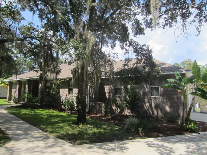 PRICE REDUCED $50,000! Tucker Bayou front Estate. Main house, carriage house, detached 2 car garage and boathouse on over one acre in Old Pt Washington. Private setting in low traffic family-oriented neighborhood. 2 large lots feature 149' on bayou with sizable dock, 2 boat lifts, outdoor fire pit. Water depth approximately 2-2.5', will accommodate medium size boat. Public launch within 1 mile. Circular driveway and plenty of room for boats, RV, expansion. Needs some minor work-seller offering $5,000 credit for interior paint, $5,000 credit for flooring replacement. No HOA. DISCLOSURE-Walton County Property Appraiser details have main house with 3 BR's. House plans show 3rd BR as an office.