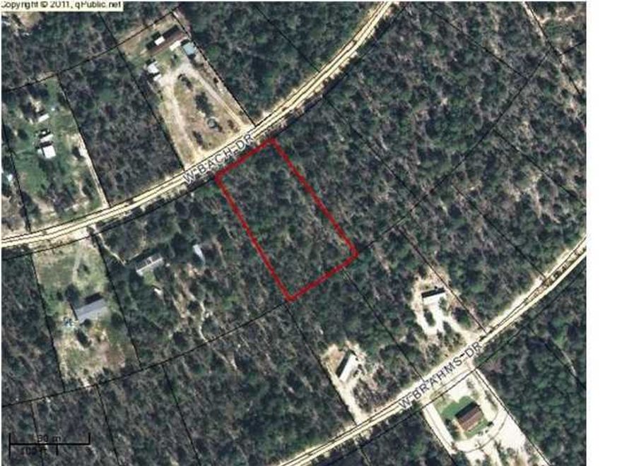 One acre lot close to town. Utilities available. Show and sell. Nice land in good neighborhood. Not a lot of restrictions. Mobile homes allowed.