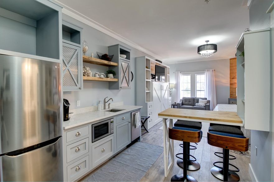 Stunning, newly renovated studio unit in The Village of South Walton overlooking the Peddler's Pavillion and 30A. This picturesque condo was stripped down to the sheetrock and completely reimagined from top to bottom with all brand new flooring, custom cabinetry with sparkling white quartz countertops, a custom built murphy bed, brand new furnishings, and endless additional upgrades.