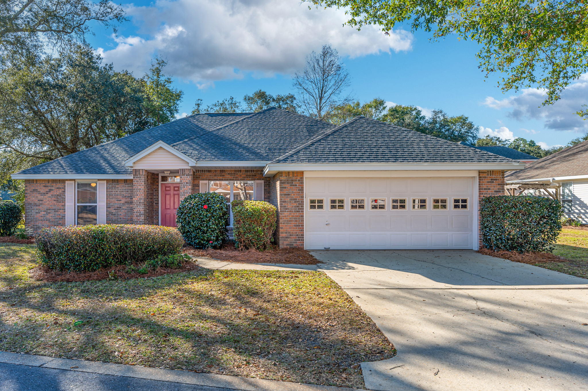 **Under Contract** Accepting Back-Up Offers.*** NEW ROOF! FURNITURE AND NEW HOT WATER HEATER INCLUDED! Exceptional corner lot example in the coveted neighborhood of Hidden Lakes, Bluewater Bay. This split floor plan is ideal with the Master Suite featuring a large walk-in closet, separate shower, bath, and double vanity. Living room includes built-in storage and a fireplace, with a casual dining area off the kitchen and a more formal open dining room off the entry (could be converted to 4th bedroom or bonus room office). Architectural features include a recessed ceiling in living room and tray ceiling in dining and master BR. Ring doorbell included! Situated in a sprawling lakeside community; 15 minute drive to the Gulf of Mexico, top notch dining, shopping, and entertainment!