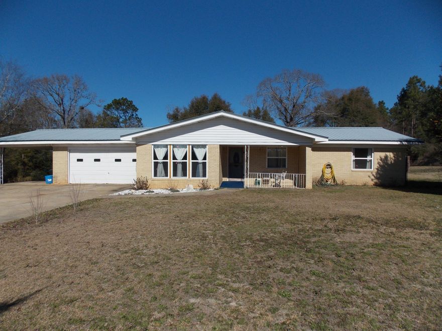 SHORT SALE! OPPORTUNITY KNOCKING!! Great potential in this home that is located in beautiful North Walton County on almost a full acre. Clean and well kept home and property. Some minor work needed. Could easily be lived in while you repair or remodel. Nice flooring, some upgrades already made such as all new windows! Could convert oversized garage easily into a master suite and laundry or mudroom area. The remodel potential is vast in this home all you need is your own style design ideas. There is a concrete block outbuilding that would be a dream workshop or the perfect game room for kids and teens. Quiet country living at an affordable price doesn't come along everyday... this could be the opportunity you have been waiting for. Call today and let's make this your home!