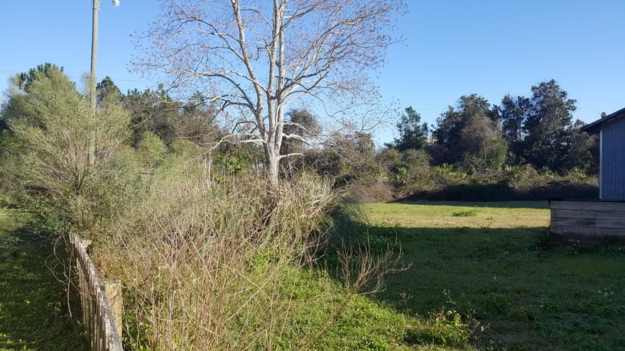 Over half acre strategically located next to the Fire Department, storage facilities, RV Parks, less than 5 minutes to the Silver Sands Factory outlets and the sugar white sand beaches of the Emerald Coast! Property has approx. 40 ft well, RV hookup, 2 Story Garage/Hobby Shop, plus a 1,980 SF single family home. All structures convey in AS-In condition.