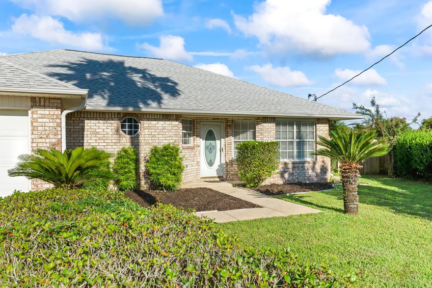 NO HOA! NEW Appliances, Refinished Flooring, New Carpet in Bedrooms; NEWLY Painted throughout home and on a Large Cul-de-sac lot with Privacy and Charm; Tucked away on a generous cul-de-sac lot, this inviting home offers both privacy and practicality with privacy fencing on the sides, chain-link along the back, and a beautiful oak tree enhancing the backyard's natural appeal; great home in the heart of Navarre, minutes from West Navarre Primary School!  Inside, the thoughtfully designed split floor plan includes a versatile second formal living or dining room at the front of the home, perfect for entertaining or customizing to your lifestyle. The bright and open kitchen is a chef's dream, featuring a center island, plenty of cabinet space, and room for a large table in the sunny breakfast area with resurfaced cabinets;  Welcome to this sunny and bright home, full of natural light and charm! As you enter, you'll be greeted by a spacious formal dining room perfect for family gatherings and entertaining. The kitchen seamlessly opens to the living area, creating a warm and inviting space that flows beautifully. White cabinets create lots of open light with a fresh look; Living area has new tiled entry to the Sliding Glass Doors; Enjoy easy access to the large, fenced backyard through sliding glass doors in the living room to an open patio, ideal for indoor-outdoor living. This home features a desirable split floor plan, offering a private master suite tucked away from the additional bedrooms. Master Bath has tiled shower/bath and double vanities for convenience! The family-friendly layout includes a cozy family room and a great floor plan for families to enjoy! Located in a quiet cul-de-sac, you'll enjoy both privacy and minimal traffic. The garage boasts stylish epoxy flooring, adding a clean and polished touch. Don't miss this bright and welcoming home that checks all the boxes for comfort, functionality, and style!
