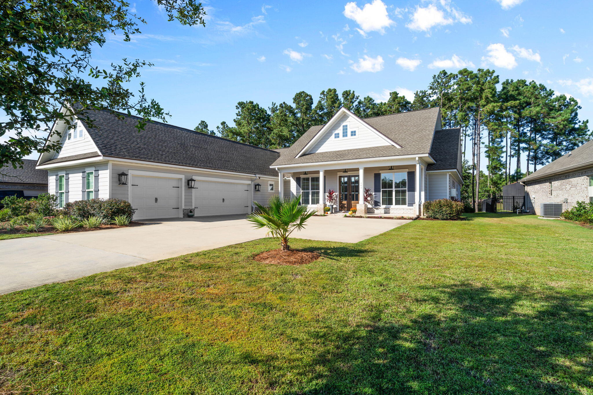 Now is your RARE chance to own on the pond in the highly sought after Buxton Mill neighborhood of Hammock Bay. Known as the Madison floor plan, this craftsman style home built by Truland is comprised of high end- signature finishes inside and out! Sophisticated carpentry is noted throughout immediately upon entrance - wainscotting in dining room, triple crown molding in the foyer, double crown molding throughout main living areas, custom built mantel, each window and doorway built with encasements, and whole house soft close doors/drawers! The spacious chefs kitchen features a single basin sink on the large kitchen island, an oversized walk in pantry, and under cabinet lighting to illuminate the stone backsplash. Recessed exterior lighting is strategically placed in the soffits, illuminating the exterior of the home for the perfect ambiance. The tongue and groove plank ceiling paneling on the covered front and back porches create a warm and welcoming experience each time you and your guests enter the home. Featuring 4 bedrooms, 3 full baths, plus a 3 car garage (with workshop) on an oversized driveway is spatially situated on over a third of an acre lot making this home as functional as it is aesthetically pleasing in its design and upgrades. Two utility sinks (one in garage and one in laundry room), tiled showers in all baths, and tile in all wet areas; owners will also enjoy the convenient use of natural gas for their 42" fireplace, stove, oven, and water heater! This home is ready to meet the needs of your outdoor Florida lifestyle. Hammock Bay is a premier, bayfront master planned community located just 15 minutes north of the white sand beaches of the Emerald Coast. A 6,000 square foot clubhouse offers residents use of the movie theatre with auditorium seating, a full caterer's kitchen to include wet bar and dining area, childs play room, and lounge overlooking the lake and pool area. Numerous on site workout and fitness facilities, competition lap pool, additional 4 Resort-style pools, pickleball courts, tennis courts, basketball court, large playground, outdoor kitchen/gas bbq areas. A Bay front club house with fishing pier extending 500' in to the bay, an amphitheater like stage with jumbotron screen, are just a few attractions with more on the near horizon! All residents at Hammock Bay will enjoy year-round social events as well as a vibrant and active Town Center. Consider this an invitation to experience the Hammock Bay Lifestyle by contacting me today for an updated list of this months community events calendar!