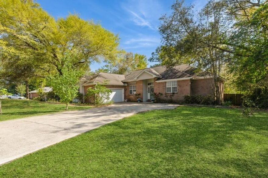 Welcome to this beautifully updated residence in Huntington, which sits on a spacious half-acre lot and offers the perfect blend of comfort, privacy, and convenience. You'll adore the large, private backyard that backs up to a peaceful wooded area, providing a serene retreat right at home. Need space for your toys? Take advantage of the boat/RV parking behind a 9-foot gated privacy fence with a dedicated gravel drive.Step inside to discover a bright and airy open-concept layout, complemented by wood flooring and newer carpet in the generously sized bedrooms. The thoughtful design creates a seamless flow from the living, kitchen, dining and flex room, perfect for both everyday living and entertaining. Another bonus is the newer HVAC system and hot water heater.