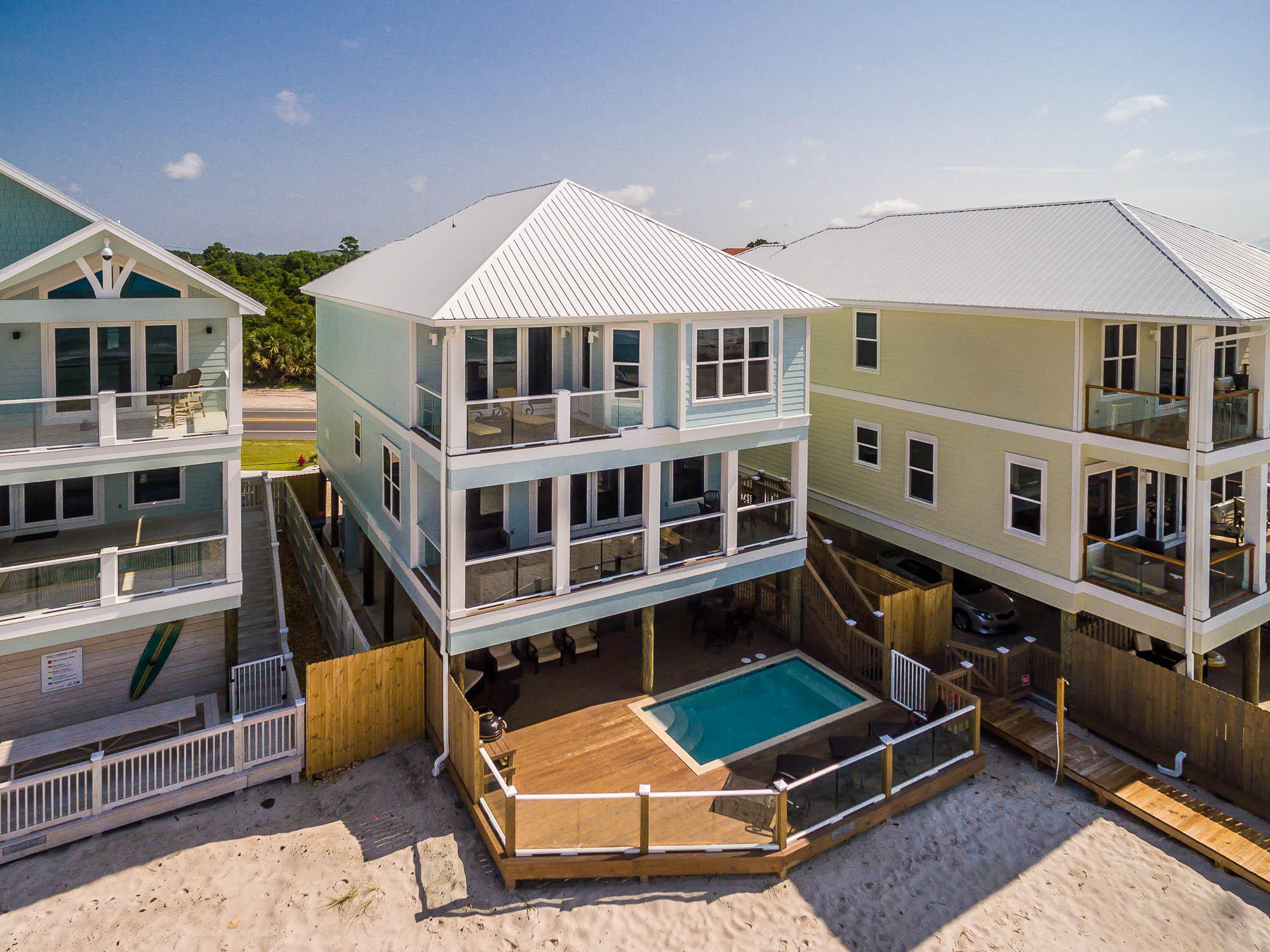 NEW CONSTRUCTION Gulf-front home on the west end of Panama City Beach (video under photos tab). Built to the highest standards and codes this 6 bedroom, 6 full baths and 2 half baths will make a wonderful family retreat, or great investment property with projections topping the 200K mark. This home has it all including a 16' X 8' beachfront pool surrounded by glass screening for full views of the beach. Outdoor space sports a pool deck with built-in grilling area, covered cabana area which serves both the sun lovers and those wanting to chill in the shade. You will find a pool bath in the ground floor foyer along with a nice owners closet. Second level is the main living space with open concept living incorporating the living room, dining room and spacious kitchen with a 11' bar.