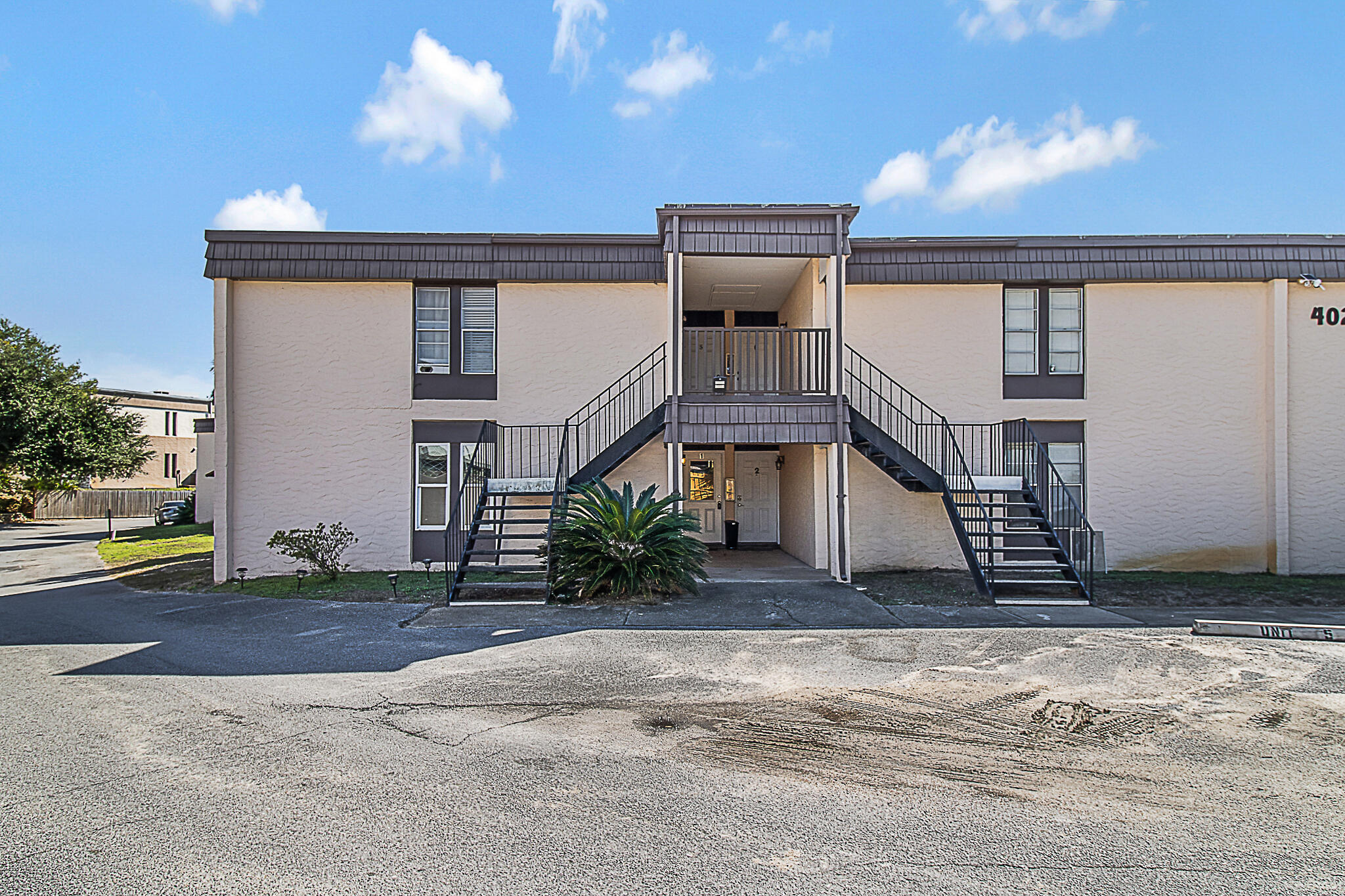 Welcome to this beautifully remodeled 2-bedroom, 2-bath condo, centrally located for convenience and lifestyle. Just minutes from Hurlburt Field, shopping, and dining, this home offers the perfect blend of modern style and comfort with a touch of Venice, Italy.This condo has been completely updated with Venetian plaster walls, custom tile showers,crown molding and recessed lighting throughout. You'll enjoy the newer kitchen with freshly painted cabinets, stylish bathroom vanities, and fresh six-panel doors. New windows, flooring, and a washer and dryer complete the package, offering a fresh, move-in-ready space. As a first-floor unit, you'll enjoy easy access to the large back patio, perfect for outdoor relaxation. The spacious living area is bathed in natural light, thanks to  the oversized sliding door. 