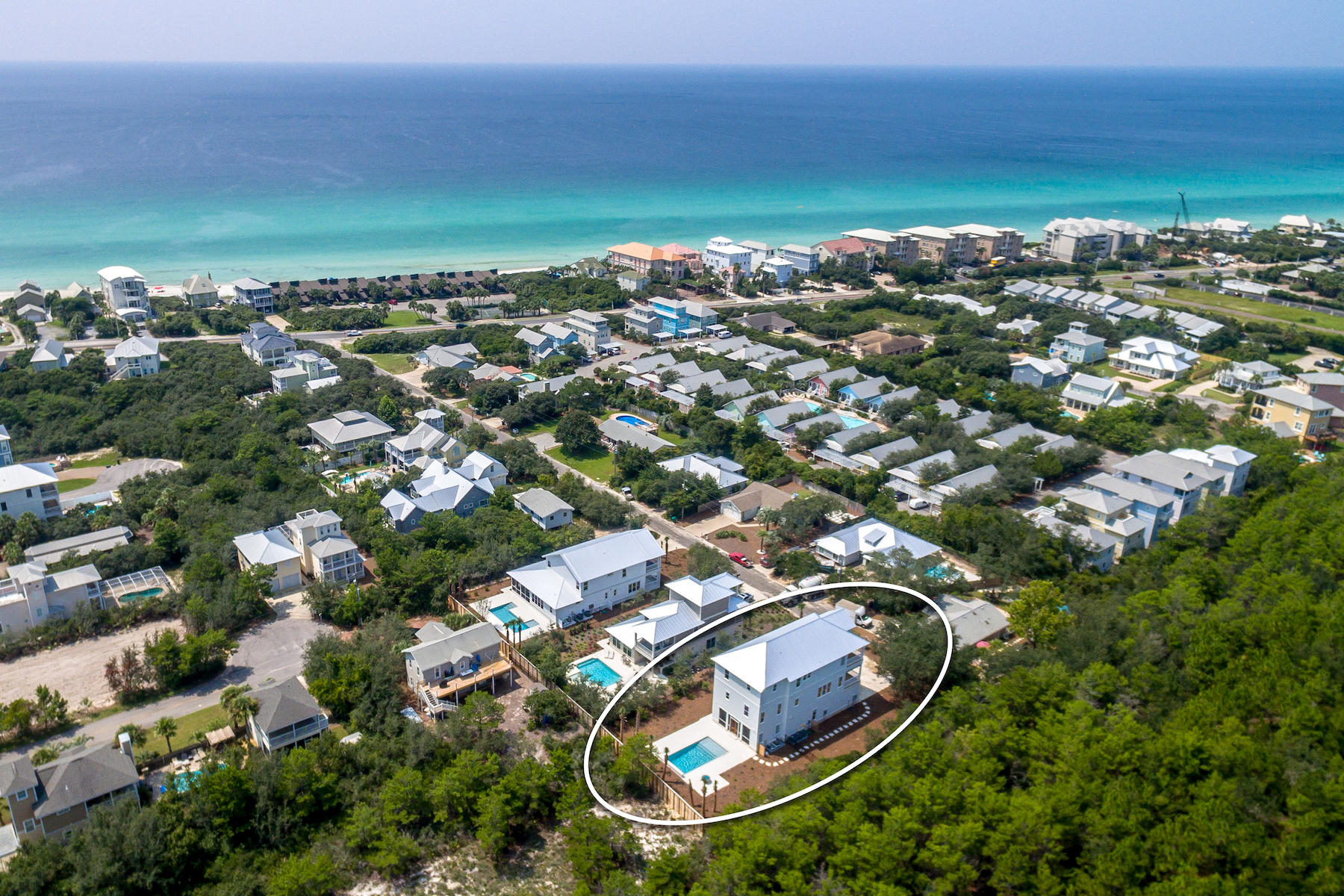This beautiful, brand new FULLY FURNISHED 5 bedroom, 5-1/2 bath 4002 SF custom built home by Cogent Builders has spectacular outdoor spaces, including a private pool, fire table, gorgeous summer kitchen and more than 1000 SF of porches. Situated on a large homesite with deeded beach access and adjacent to Camp Creek Golf Course, this home has rental projections from a $160K to $187K. The first floor includes a guest bedroom with an ensuite bath, a laundry room and elevator access to the 2nd and 3rd floor. The second floor boasts an open concept floor plan, including a large gourmet kitchen with solid wood cabinetry, Calcutta Quartz countertops, a Thermador, 36'' gas 6 burner range top, double oven, 2 dishwashers, a Uline beverage center, Sharp microwave drawer and an oversized