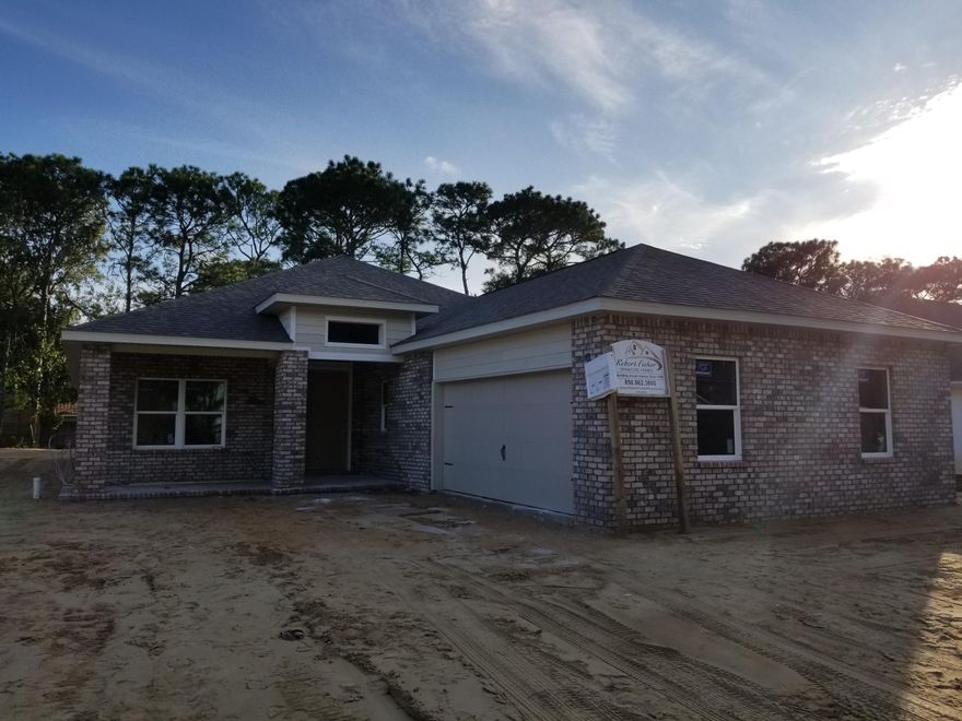 Beautiful Brand New Home located in the heart of Shalimar. Available for occupancy in January. This unique plan offers 2 Master Bedrooms with the Master Bath in between. Perfect if your spouse is a heavy snorer, nursery, or in home office. Wood floors throughout all the main areas. Tile floors in the Laundry and Baths. Carpet in the bedrooms. Lots of cabinetry in the Kitchen that is open to Living and Dining areas. All the windows in the home are impact rated and low ''E'' glass. The back yard has plenty of room for a large pool etc. Don't miss this opportunity to own a brand new home at a very reasonable price.