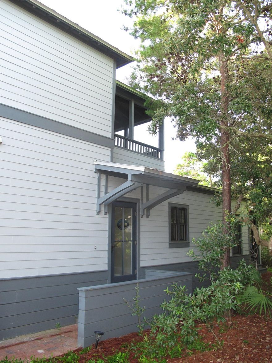 Cozy and charming beach cottage in the desirable neighborhood of Magnolia Cottages by the Sea only a 5 minute walk to the beach! Popular with renters and second homeowners alike, this neighborhood features brick paver streets, a community pool, and deeded beach access along with golf cart parking near the beach. It is also near the communities of Alys, Rosemary, and Seacrest Beach for lots of options for dining and entertainment.
Featuring hardwood floors throughout, this beach house offer three bedrooms and three baths. A second floor private master suite with walk-in closet and double vanity has its own covered and screened porch overlooking the tree tops. Two bedrooms are downstairs, one with en suite bath and the second shares a convenient full hallway bath. This floor plan is great for family gatherings. The open living, dining, and kitchen area opens out to a large screen porch with room for seating and outdoor dining options. The home has lots of privacy offered by the lush, native landscaping and is also very convenient to the community pool. An outside storage area and outside shower complete the home and make for easy trips to and from the beach. 

Although not currently on a rental program, this beachy cottage would make an excellent vacation rental home. Sold furnished with some exclusions. Rental Projection under Documents tab.