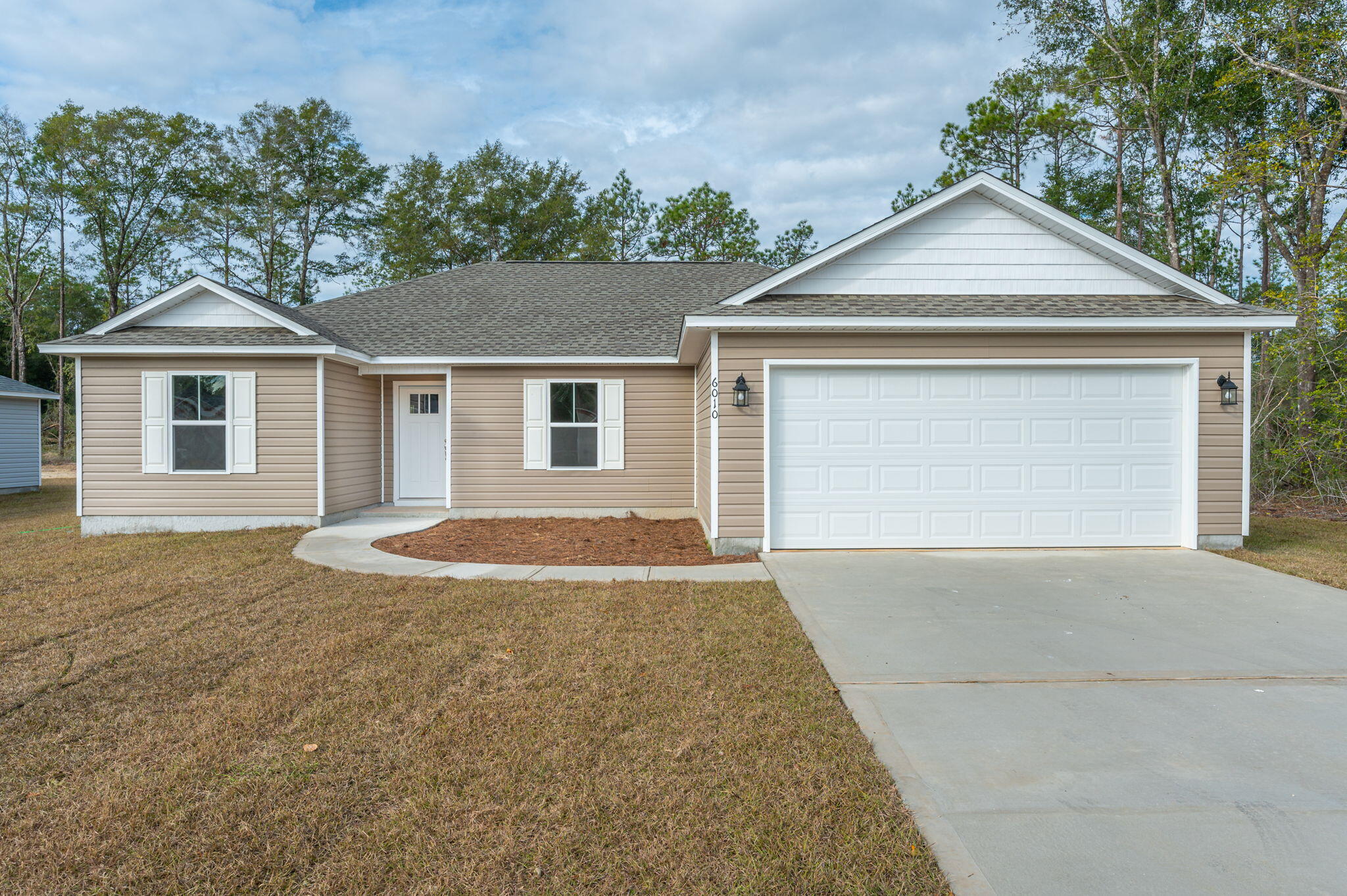 Seller will pay up to a total of $8,000 to close, ready and COMPLETE. Solid wood cabinetry, granite kitchen counter tops. ALL flooring Luxury vinyl throughout. Open floor plan with split bedroom, spacious guest bath, nice master bath with dual sink vanity, soaker tub as well as separate shower. Nice walk-in closet, inside laundry. Patio on rear. This is an energy efficient home close in, but outside city limits so lower taxes. Nice, neutral, popular decor. Sod will be front, partial side and back, total of 14 pallets. Appliances will include a Micro-hood, solid surface Range, self-cleaning, and dishwasher in stainless steel.  Great location that is convenient to Elgin AFB, Niceville as well as Crestview.Photos are of completed home, same plan.Please call LA for addm when making offer