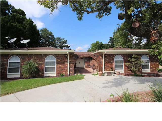 Don't miss your chance to own this 4 bedroom 2 1/2 bath home, one of the largest non-waterfront lots in the much desired neighborhood of Poquito Bayou. Roof and windows were replaced in 2005 and Brand new Air conditioning in July of 2013. This home features bamboo hardwood flooring throughout the main area. Kitchen has granite countertops with flat surface stove and tons of custom cabinetry that you will have a hard time filling up and window seat by fireplace with extra storage too. This Kitchen is a cooks dream. Master bedroom has a dual shower head with marble surrounding it. All rooms are spacious and have fresh paint that is less than 3 years old. The back yard features a large pool that has been well maintained and is totally enclosed so those swims and times outside can be