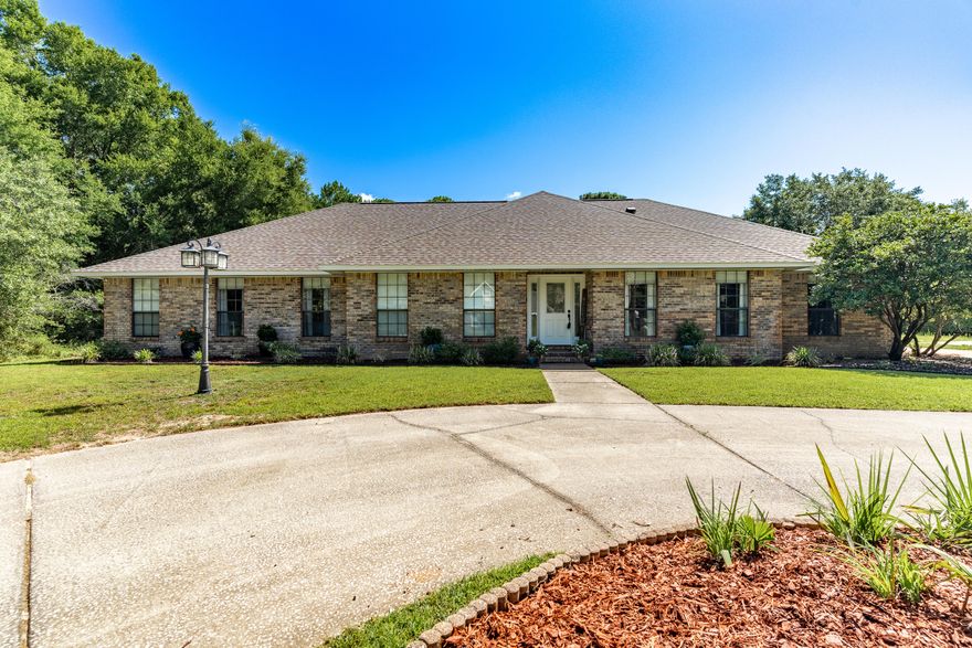 Welcome to this beautifully maintained and spacious brick home, perfectly situated on almost 3/4 of an acre in a quiet cul-de-sac in the highly desirable Holley by the Sea community. Featuring 5 generously sized bedrooms, 3 full bathrooms, a sparkling screened-in pool, this home offers something for everyone.Upon entry, you're greeted by a welcoming foyer flanked by a formal dining room and a formal living room, ideal for entertaining. The main living area boasts a stunning brick, wood-burning fireplace and provides direct views and access to your private backyard oasis.The kitchen is designed with both style and functionality in mind, showcasing granite countertops, stainless steel appliances, ample cabinet space, and a charming breakfast nook. The luxurious primary suite offers a private pool access and a fully renovated en-suite bath complete with quartz countertops and a walk-in tile shower.
Two of the spacious guest bedrooms share a beautifully updated Jack-and-Jill bathroom, while a third guest bedroom and full bath are tucked away perfect for guests or extended family. The 5th bedroom off the kitchen adds even more flexible space, ideal for a home office, playroom, or media area.
Outdoors, the screened-in pool area provides a serene space for both entertaining and relaxation. You'll also enjoy a 16'x40' workshop complete with electricity and HVAC, a 14 x 14 storage shed, as well as an outdoor fireplace perfect for year-round enjoyment.
This exceptional home combines indoor comfort with outdoor living and is a must-see for any buyer looking for space, privacy, and amenities in Holley by the Sea.
The roof was replaced in 2020. Water heater 2021. HVAC 2014
