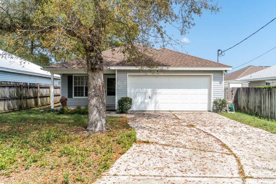 This charming starter home is ideally situated in the heart of Fort Walton Beach, offering both convenience and comfort. Upon entering, you are greeted by a spacious living room filled with abundant natural light. The open-concept design seamlessly connects the living area to the kitchen and dining space, creating an inviting atmosphere for everyday living and entertaining.The kitchen is equipped with a gas stove and a recently installed garbage disposal. The generously sized master bedroom provides ample space for all your furnishings. Step outside to the fenced backyard and enjoy your morning coffee from the covered back porch.For added convenience, the laundry room is located indoors. Recent updates include a new roof in 2022 and a water heater replaced in 2019, HVAC 2012.  The washer and dryer convey as-is, and the home is protected by the Sentricon termite system. Don't miss this fantastic opportunity to own a well-maintained home in a prime location!