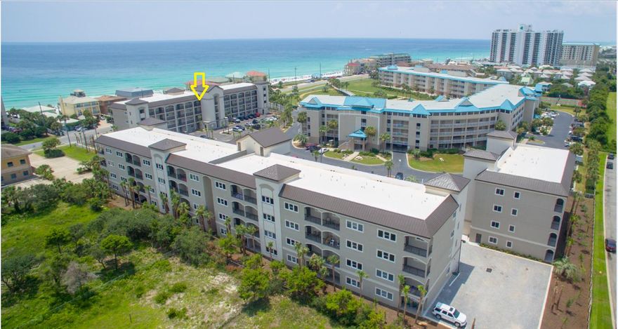 Property is offered unfurnished- pictures are of furnished model. Top floor beach condo with Westerly views of the gulf. Directly across the street is the beach via one of two deeded beach accesses (1 private), or hop in your golf cart for a short ride to shopping, dining and entertainment on Scenic 98. This 4th-floor condo offers wood floors throughout with tile in baths; 10-foot ceilings and crown molding in living area, custom wood blinds have also been added in all rooms. Granite counter tops in kitchen and baths, stainless steel appliances and washer and dryer. En suite master bath is complete with double sink vanity, soaking tub and walk in shower with frameless door.