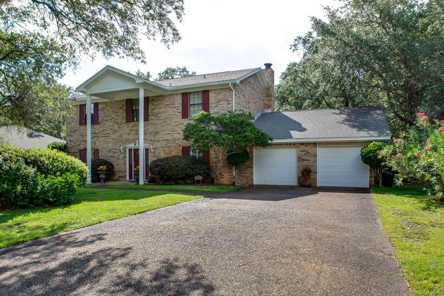 Welcome to this gorgeous, 2 owner home that once was the pride of The Parade of Homes, in the gated community of Southwind! This 5 bedroom executive style home features 2 and a half baths, lovely, real wood doors, 8'' baseboards, 2 living areas, one boasting a gas fire place that warms the entire downstairs when in use! The eat in, bay windowed kitchen is a cooks dream with a center island, double ovens, and an arched brick wine/coffee niche, reminiscent of old world Tuscany. The formal dining room has a huge picture window, allowing you to enjoy the view of the lush landscaping in the backyard. There's a deck, perfect for grilling out. A screened in porch, for relaxing, or potting area for your plants. The over sized, dual garages actually fits 4 cars, easily. Newer garage doors are