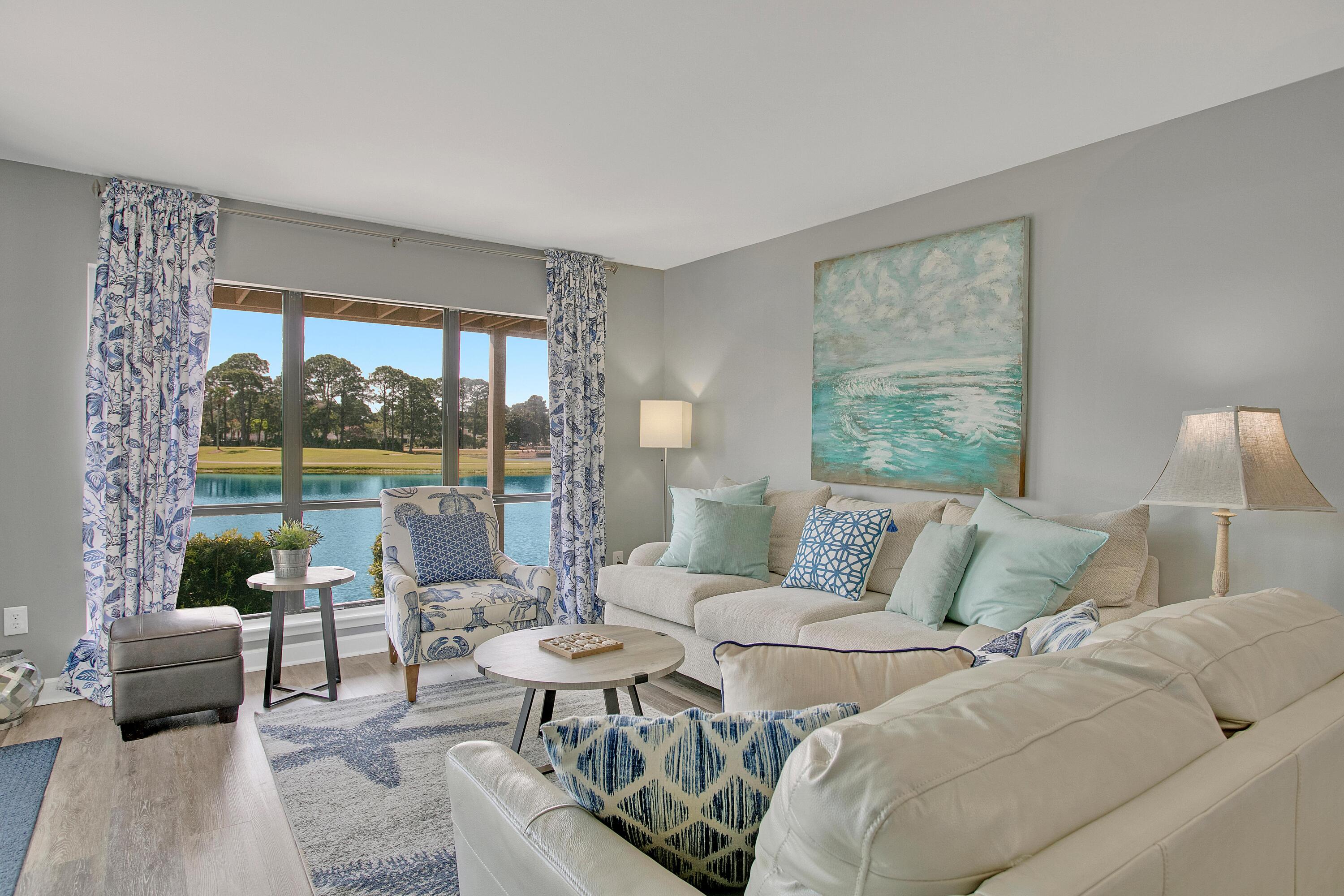 Beautifully updated first floor, corner condo with balcony overlooking the lake, ideally located in Harbour Point.Quartz countertops in kitchen, coastal furnishings and decor, new wood-like vinyl flooring, stainless steel appliances and gorgeous western views overlooking the lake! HVAC replaced June 2020. Hot Water Heater replaced Feb 2023. Roof replaced 2017.Perfect as a home or vacation rental investment, turn key and ready.This property is currently on a short term vacation/rental program and contracts could be subject to reservations made on or before final contract date. Waiting list for assigned golf cart parking spaces. Owner willing to sell golf cart separately.