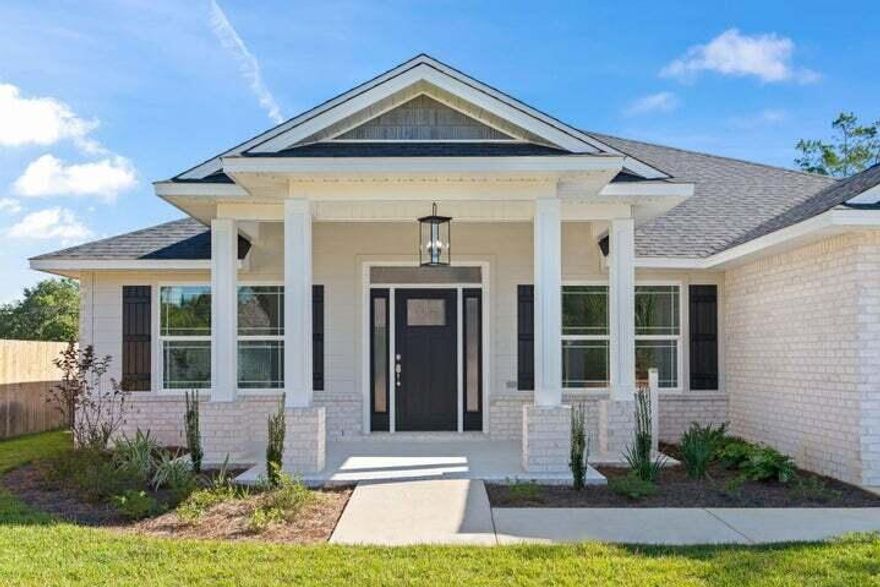 NEW CONSTRUCTION!! All brick 5 Bedroom, 3 full Baths, 2236 square foot home in East Navarre. No HOA. This split floor plan home features a spacious great room, dining area and a large kitchen with granite counter tops, soft close cabinet drawers, pot filler, tile backsplash, Gas range, built-in microwave and dishwasher. The home has luxury vinyl plank floors through out the home. The Master Suite features: a Large tiled shower, garden tub, double quartz vanity, luxury vinyl plank and a large walk-in closet.. There is a 11x17 covered porch on the back of this home. Large backyard.