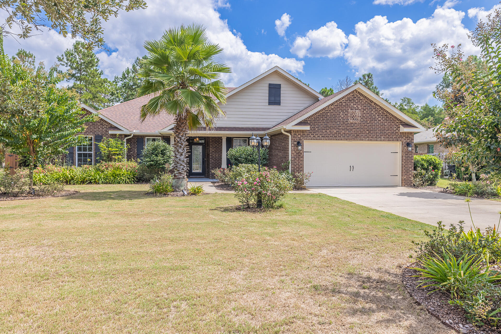 Stunning 4 bed / 3 bath home with a POOL, tucked away amongst lush landscaping in desirable Hammock Bay! This home features a gorgeous brick exterior, charming front porch which leads into a grand foyer. Delight in an open and airy floor plan offering a spacious living room with gas fireplace, formal dining room, and flex space that could be transformed into an office or den. Hardwood flooring, crown molding, and tray ceilings are found throughout much of the home. The kitchen showcases granite countertops, stainless steel appliances, large island with breakfast bar, and a separate breakfast nook that overlooks the pool.Retreat to the primary bedroom where you'll relax and unwind; separate sitting area, and luxurious en-suite bathroom featuring double-sink vanity w/ granite countertops,