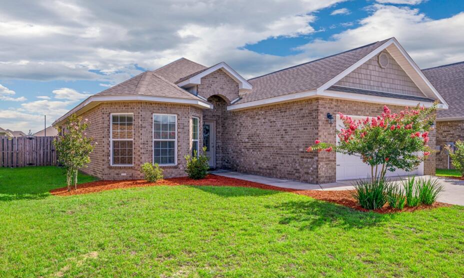Community POOL! The Isabella floorplan 1948 sq ft. This Freshly Painted Split Plan is a 4 bed/2 bath home filled with upgrades and custom touches. Luxury Vinyl Plank Flooring in Entryway/Hallways/Dining Area & Kitchen. The Open Kitchen has an Island/Breakfast Bar/Stainless Steel Appliances/Granite Countertops & New Subway Tile Backsplash. The Living Room is Defined by a Carpet Inlay and Trey Ceiling. The Private Master Suite has Carpet and Trey Ceiling. Master Bath Offers a Separate Tiled Shower/Granite Double Vanity/Garden Tub with New Tiled Surround & Large Walk-in Closet. The 3rd and 4th bedrooms are separated by another Full Bathroom with Shower/Tub Combination and Granite Countertop. Covered Back Porch/Privacy Fenced Backyard and a 2 Car Garage. Redstone Commons is a Great Community with a Playground / Dog Park / Large Private Pool/Covered Pavilion with Outdoor Kitchen/Granite Counters and Lounge space. All this just minutes from Shopping, Hospital & Interstate 10. *( Rooms have been upgraded to gray paint since pictures were taken )