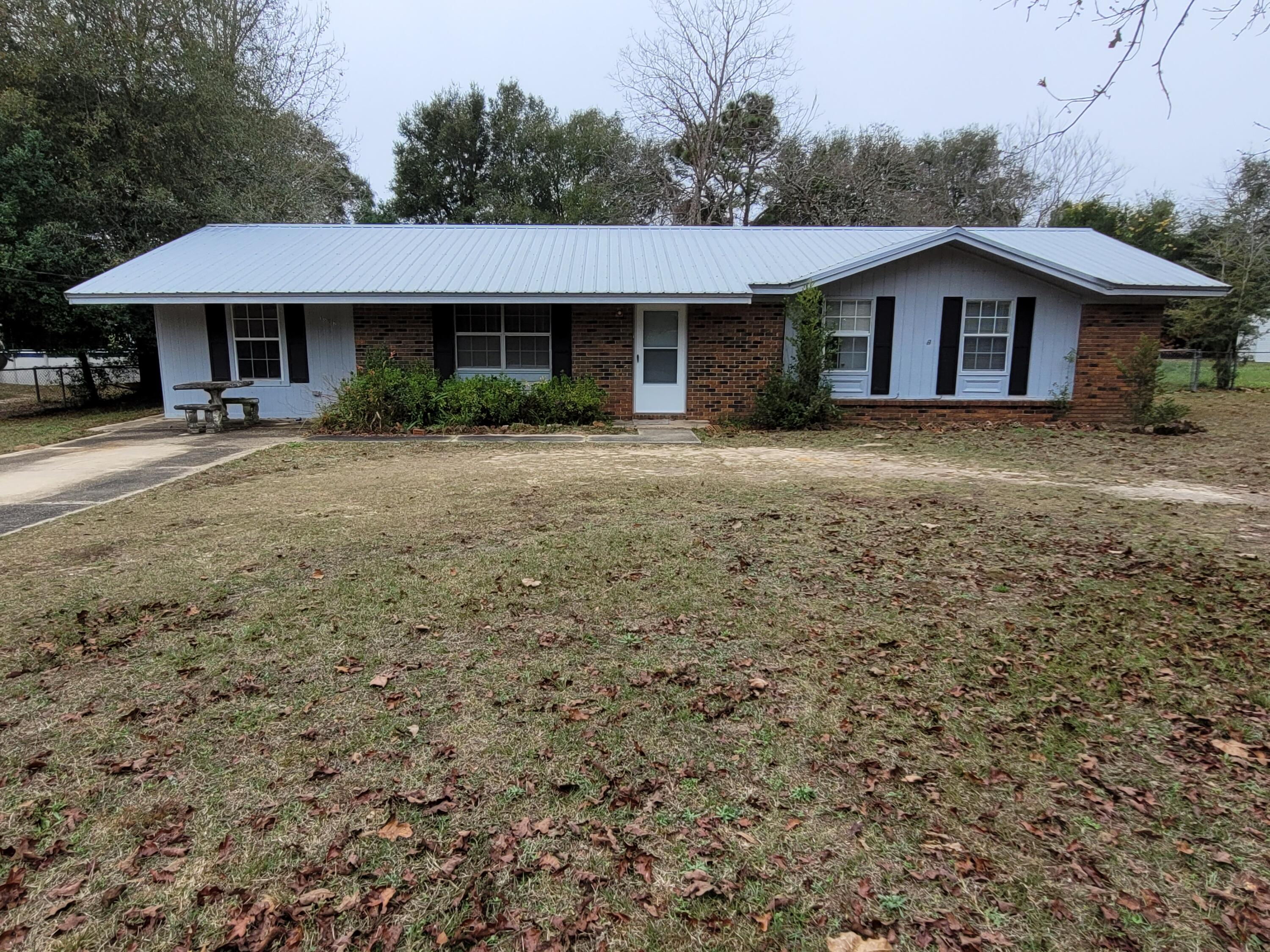 3 Bedroom, 1 Bath on large lot with fenced level back yard~ Metal roof with 12 X 20 shed in the back yard~ Screened back porch.New flooring installed in kitchen, dining room, hall and laundry room. New interior doors and fresh paint, new water heater~ New electrical panel and aluminum wiring corrected~ Being sold AS IS~