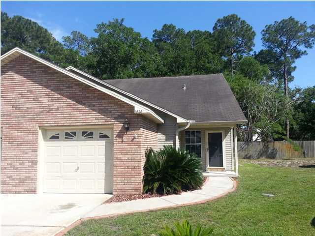 Immaculate end unit townhome with 3 bedrooms and a 1 car garage. This home is beautiful and ready for occupancy. The townhome has wood floors downstairs and new carpet upstairs. Back patio for entertaining includes built in gas grill. Pet is possible with approval - restrictions apply. Easy care yard. Association takes care of most of the yard.