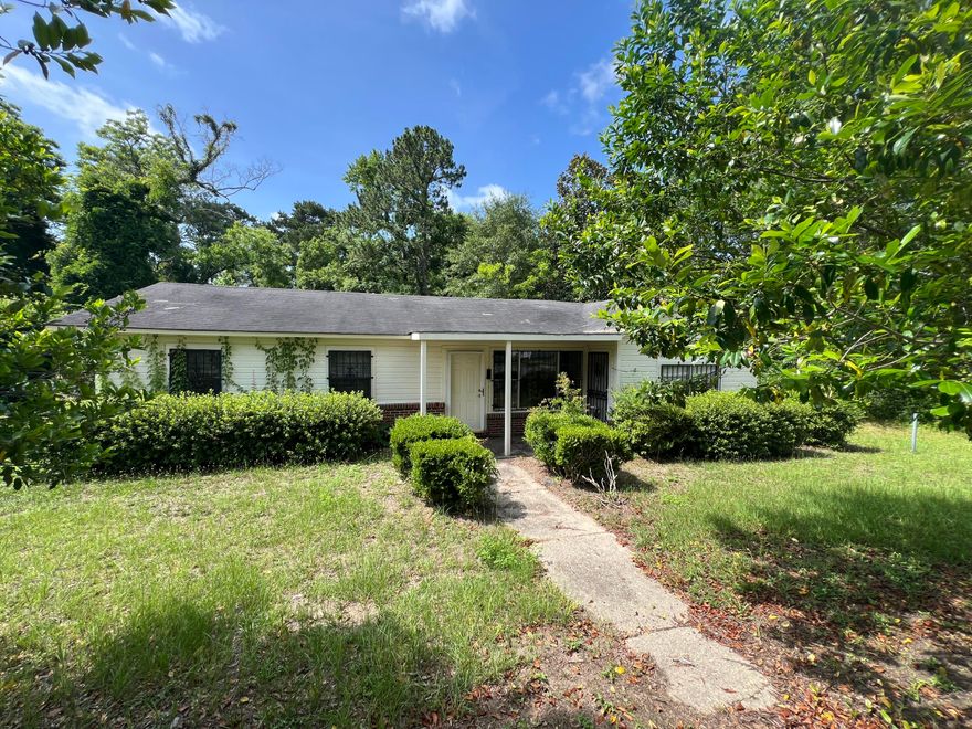 Property is being sold as land only.  Home needs demolished due to extensive damage. Adjoining lot is included.
