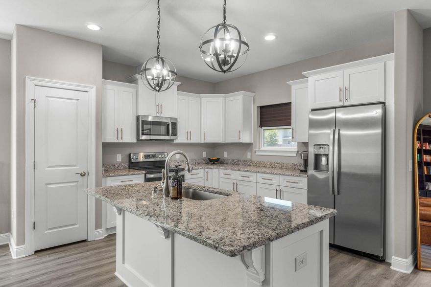 Like-New Corner-Lot Home in East NavarreOnly 3 years young, this Robbins-built home feels brand new--complete with all the finishing touches already in place. Perfectly positioned on a corner lot in desirable East Navarre, it offers quick access to Navarre Beach, local shopping and dining, and Hwy 98 for an easy commute to Hurlburt Field AFB.Step onto the welcoming covered front porch and into a bright foyer with soaring ceilings that flow seamlessly through the open-concept layout. The spacious great room is filled with natural light, while a second family room at the back of the home provides a cozy retreat with floor-to-ceiling built-in bookcases, ample storage, and glass door leading to a covered back patio and fully fenced yard--ideal for entertaining or unwinding on warm evenings The gourmet kitchen showcases all-wood white shaker cabinets with crown molding, gleaming granite countertops, stainless steel appliances, a center island, breakfast bar, and a dedicated dining areaperfect for busy mornings or casual gatherings.
The generous primary suite features a spa-inspired bath with an oversized tiled walk-in shower and seamless glass door, dual granite vanities with rectangular under mount sinks, sleek mirrors, and a spacious walk-in closet. Additional bedrooms are well-sized with ceiling fans and double-door closets, while the second full bath includes a granite vanity and tub/shower combo. Two extra hallway closets provide added storage. Conveniently positioned off the garage entry, a practical corridor houses a half bath, spacious laundry room, and under-stair closetkeeping daily essentials organized and easily accessible.
Luxury vinyl plank flooring flows throughout, while hurricane window protection and a dimensional shingle roof help reduce insurance premiums.
Move-in ready and close to everything East Navarre has to offerschedule your private tour today!
