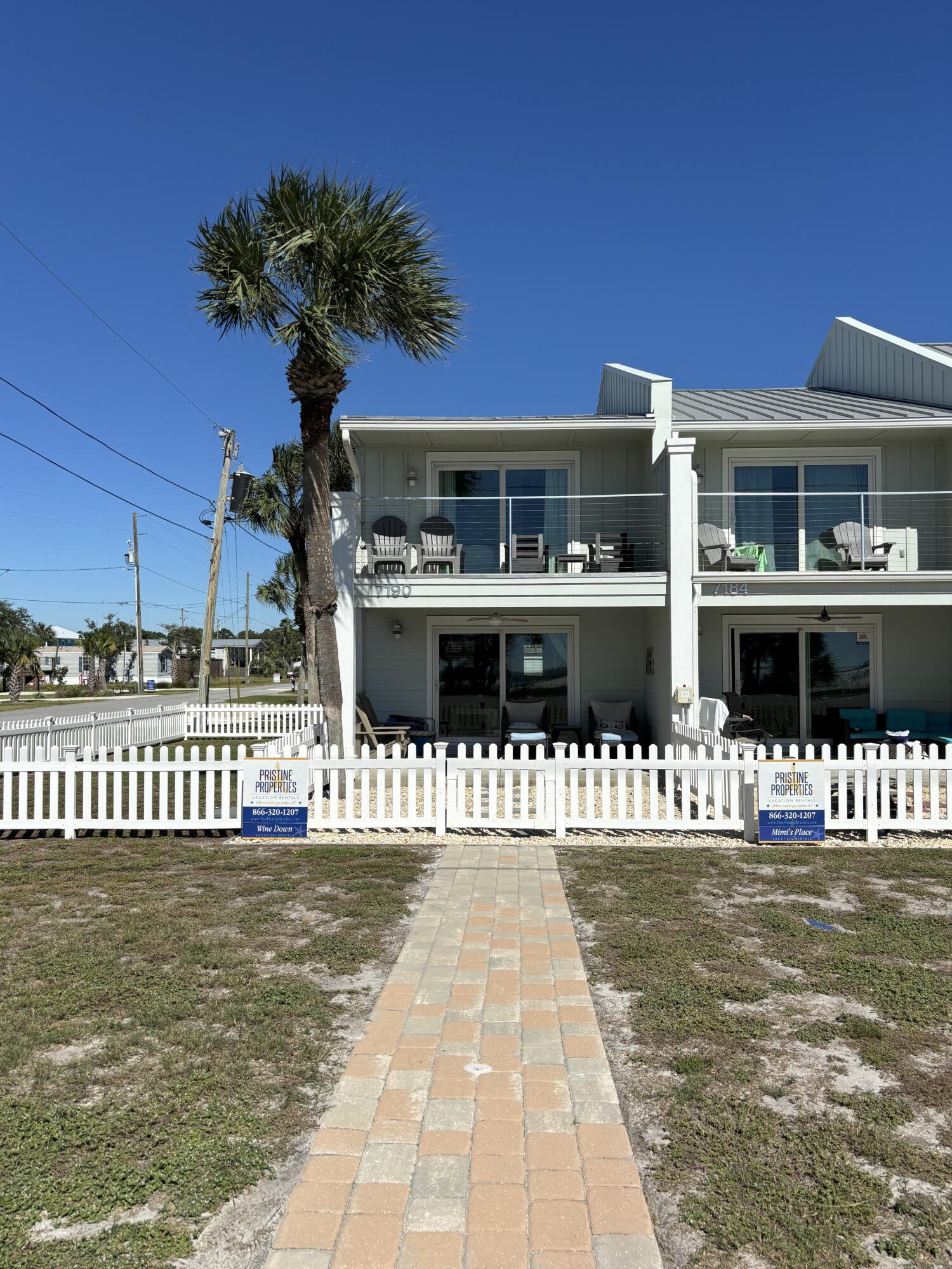 Beautiful year round sunsets over the Gulf of Mexico from this 2 bedroom 2.5 bath lovely appointed townhome. This end unit is a rarity at the beach as one will actual own a spacious side yard that can be used as a pet area (currently) or boat/ beach toy parking. Totally renovated in 2021 and located in the COVETED X FLOOD ZONE, this open plan 2 story property has a nice ground floor plan with kitchen, dining area, laundry, storage, 1/2 bath, generous living area that opens up to an open and covered patio/courtyard and fenced side yard that overlooks the Gulf of Mexico. The second level consists of 2 bedrooms and two baths, one bedroom has its own open deck for even more options to enjoy the remains of the day, Well maintained and very clean unit with amenities that include; granite countertops and kitchen island/ breakfast bar, undermount sink, generous counterspace and cabinetry, double pane sliding glass doors and windows, double parking in the rear with a wooden privacy fence, and electric vehicle charger.